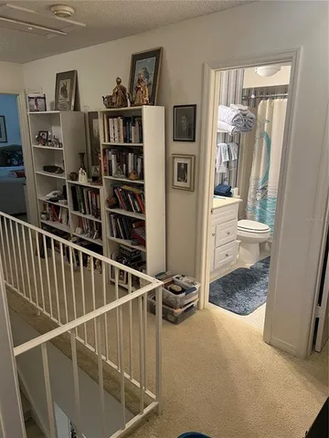 a view of a hallway with shelves