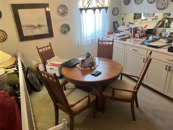 a view of a dining room with furniture and window