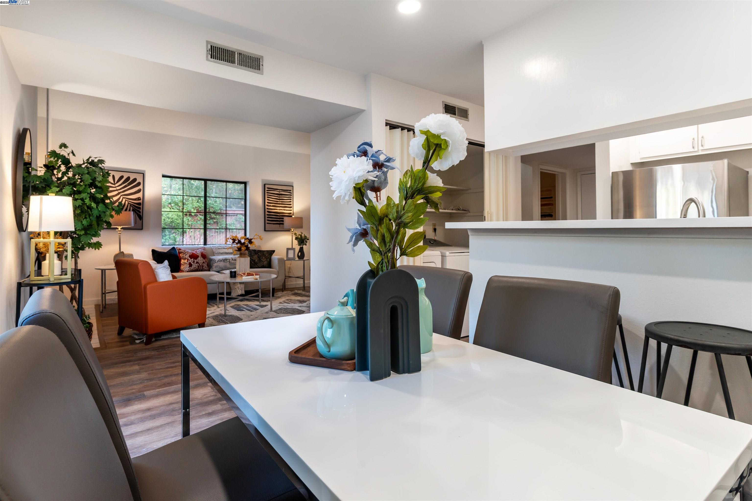 601 Palomino Drive, Unit C Pleasanton, CA 94566 - Photo 11 of 41 a view of a dining room with furniture and a potted plant