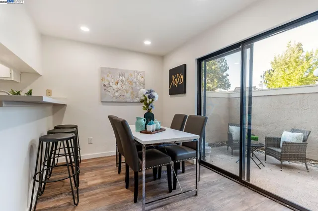 a view of a dining room with furniture window and outside view