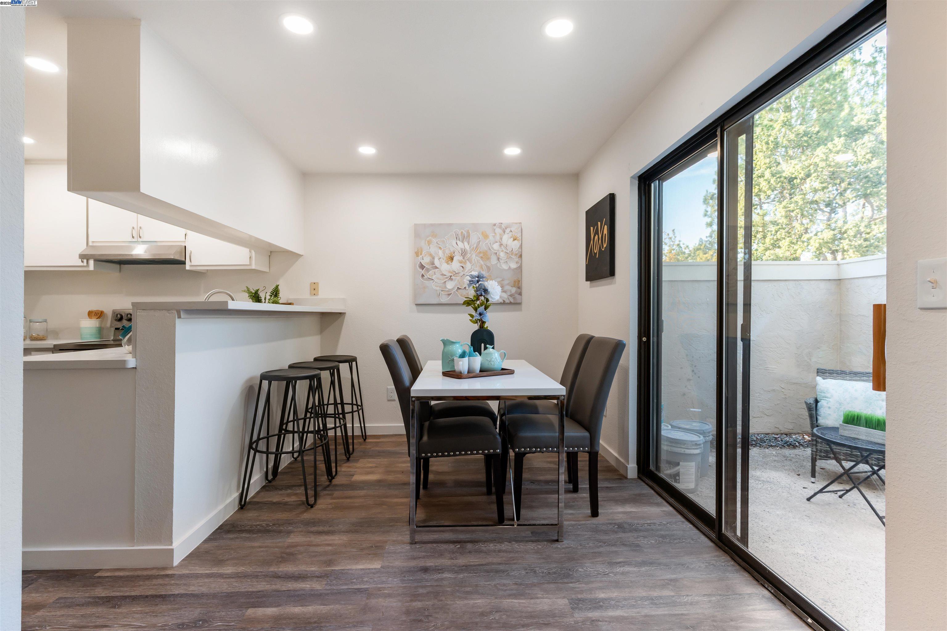 601 Palomino Drive, Unit C Pleasanton, CA 94566 - Photo 13 of 41 a view of a dining room with furniture window and wooden floor