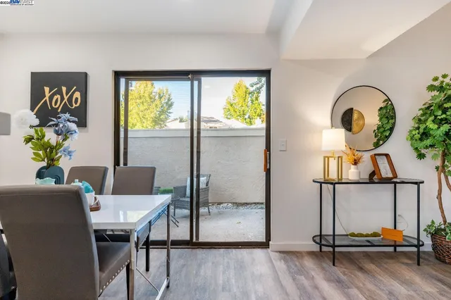 a view of a workspace room with furniture window and wooden floor