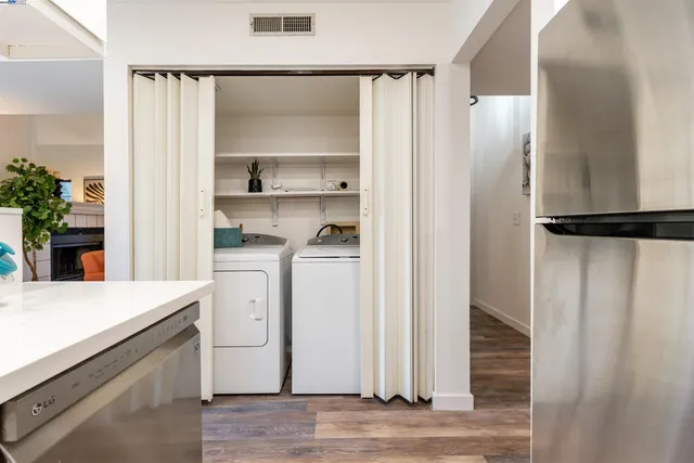 a kitchen with a refrigerator and a sink