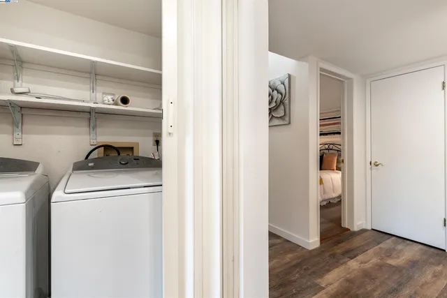 a utility room with closet dryer and washer