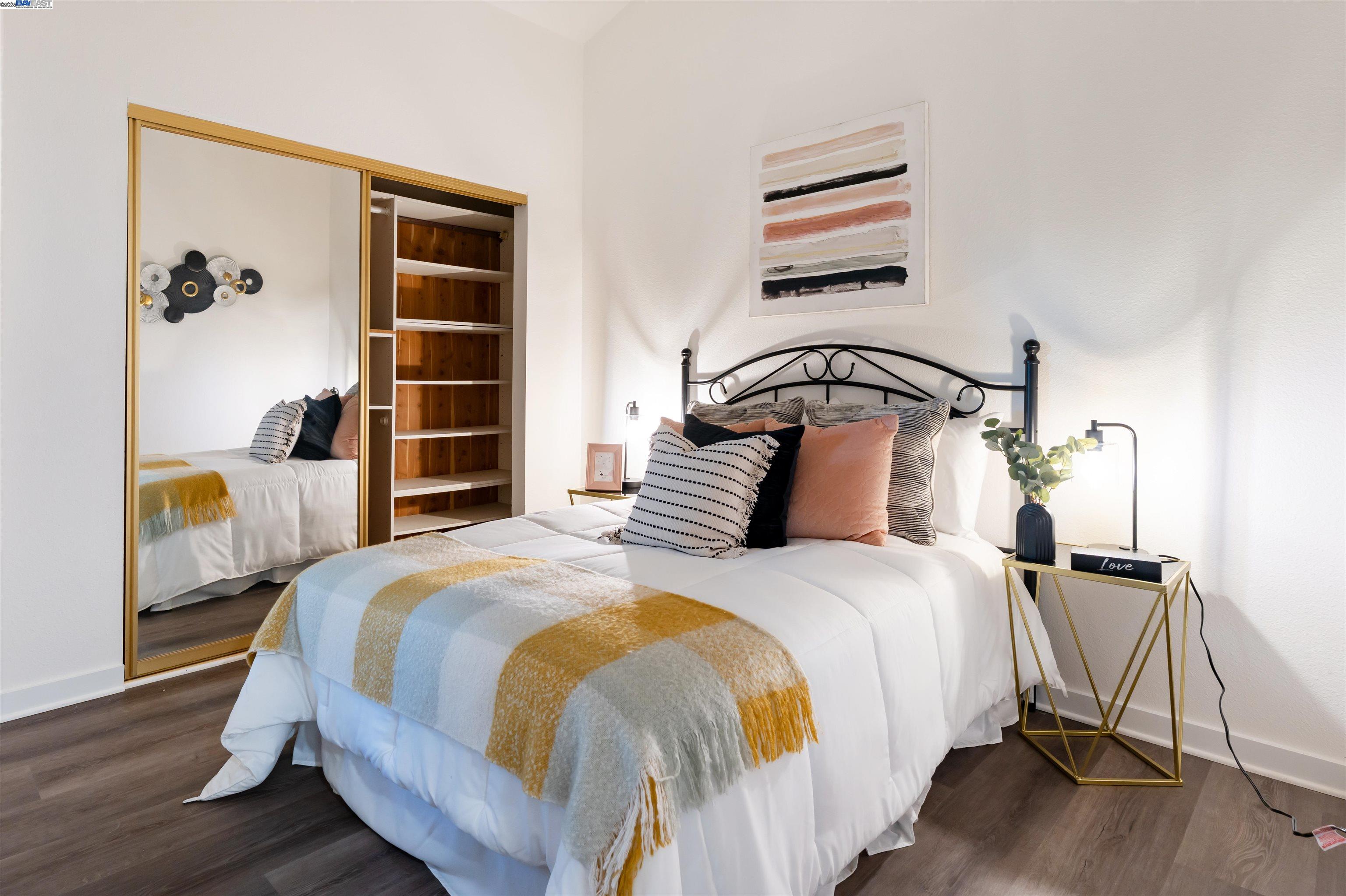 601 Palomino Drive, Unit C Pleasanton, CA 94566 - Photo 25 of 41 a bedroom with a bed and wooden floor