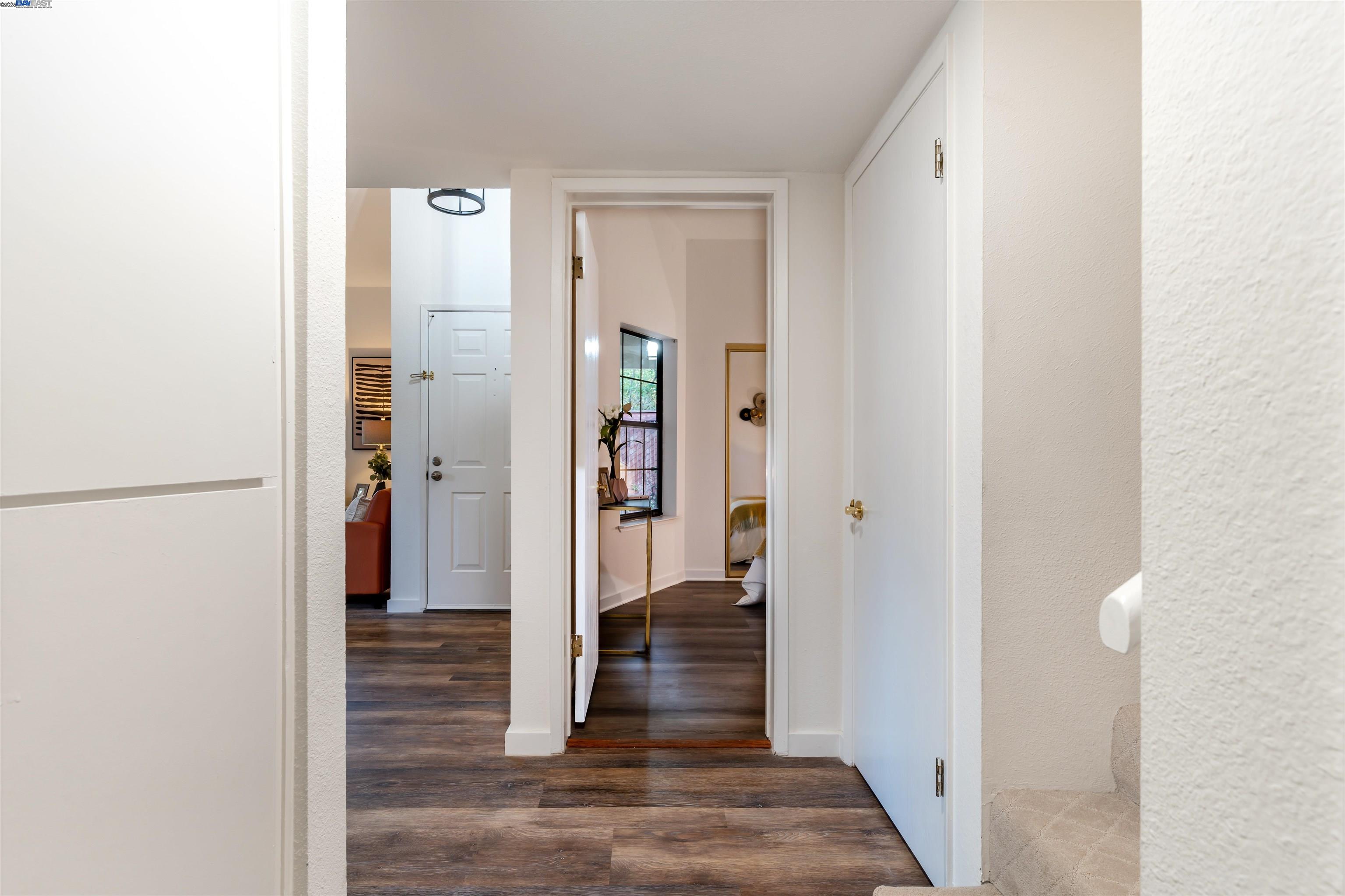 601 Palomino Drive, Unit C Pleasanton, CA 94566 - Photo 28 of 41 a view of a hallway with wooden floor and closet