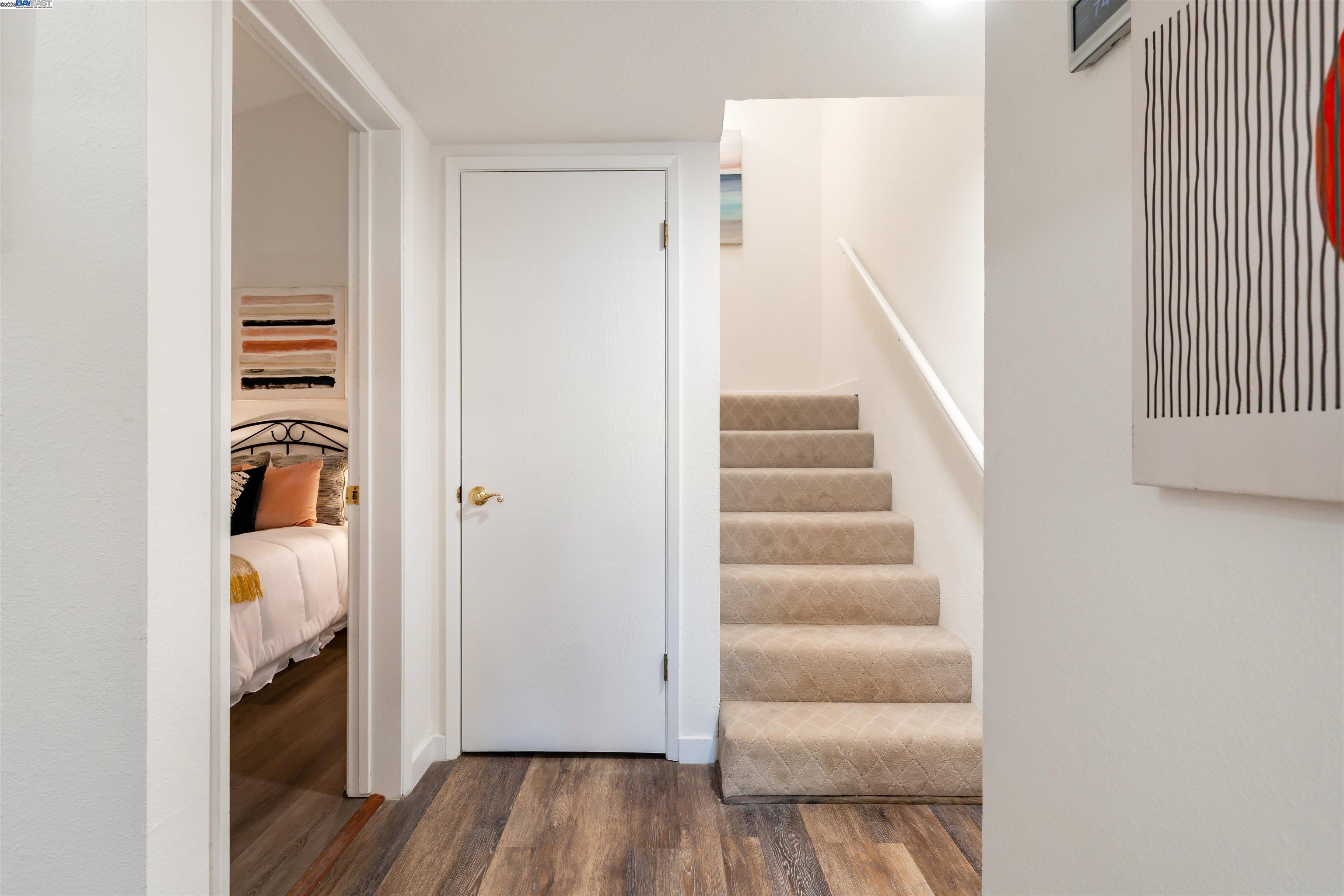 601 Palomino Drive, Unit C Pleasanton, CA 94566 - Photo 31 of 41 a view of a hallway with wooden floor and entryway