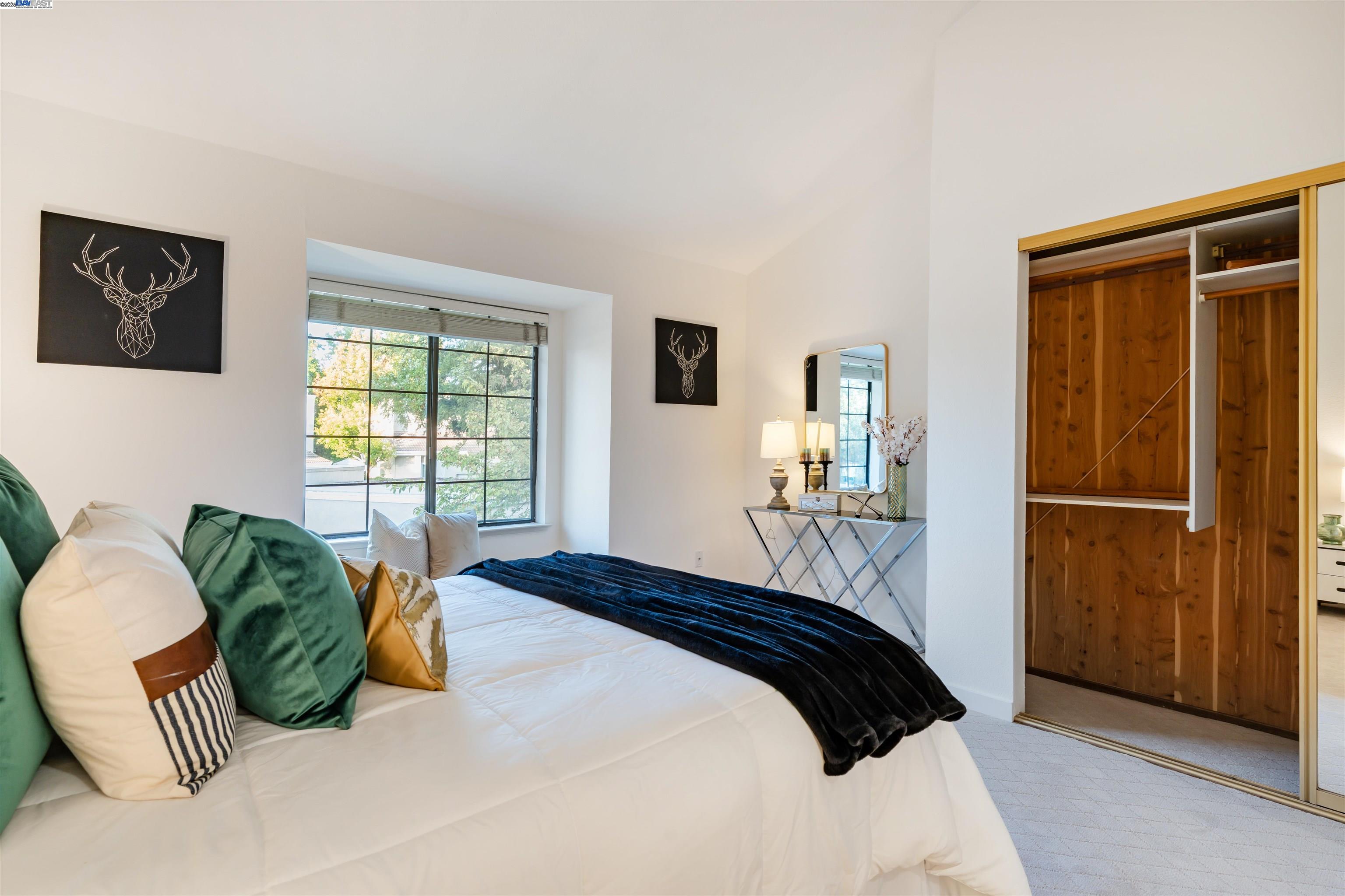 601 Palomino Drive, Unit C Pleasanton, CA 94566 - Photo 33 of 41 a bedroom with a bed and wooden floor