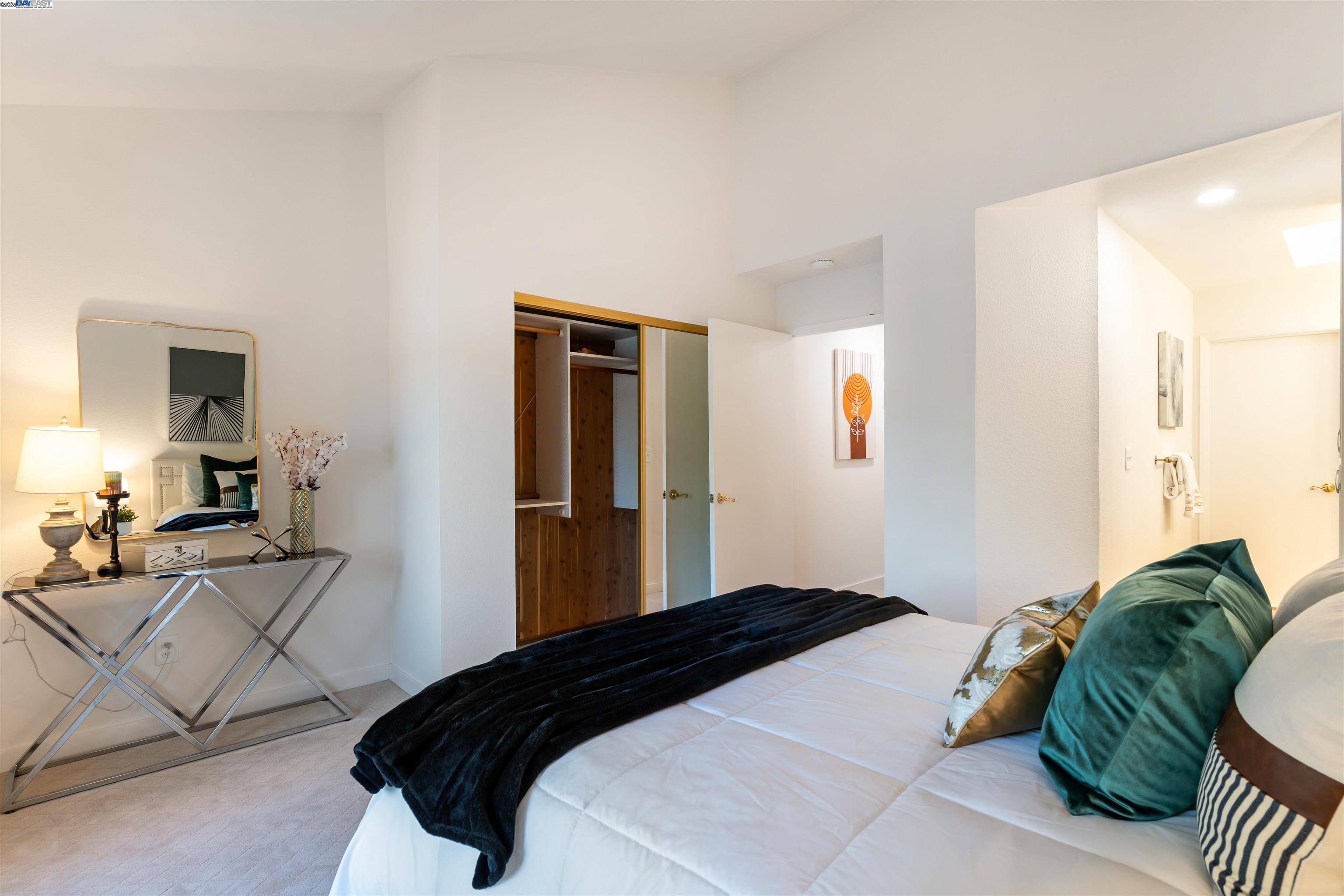 601 Palomino Drive, Unit C Pleasanton, CA 94566 - Photo 35 of 41 a bedroom with a bed and mirror