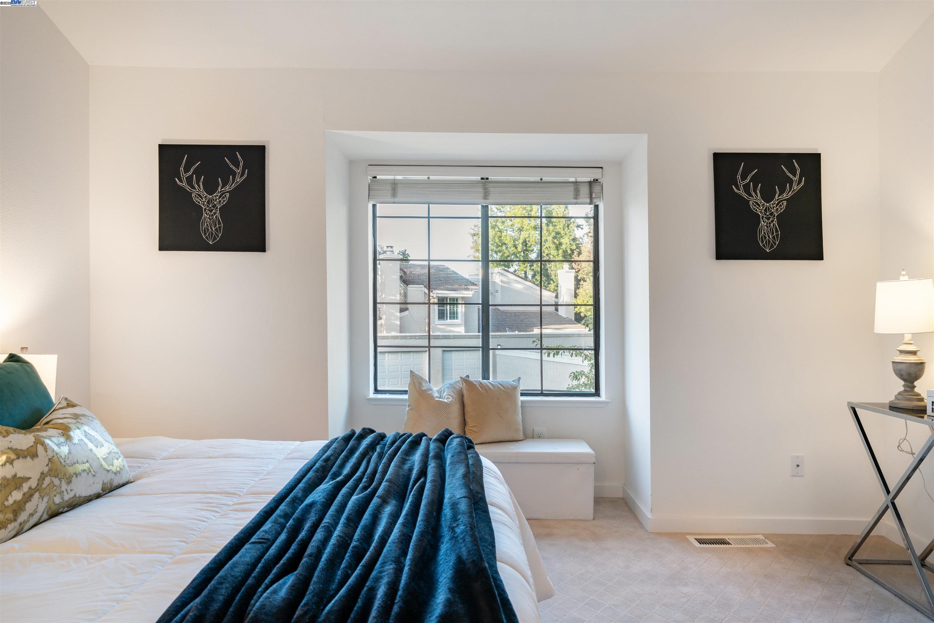 601 Palomino Drive, Unit C Pleasanton, CA 94566 - Photo 37 of 41 a bedroom with a bed and wooden floor