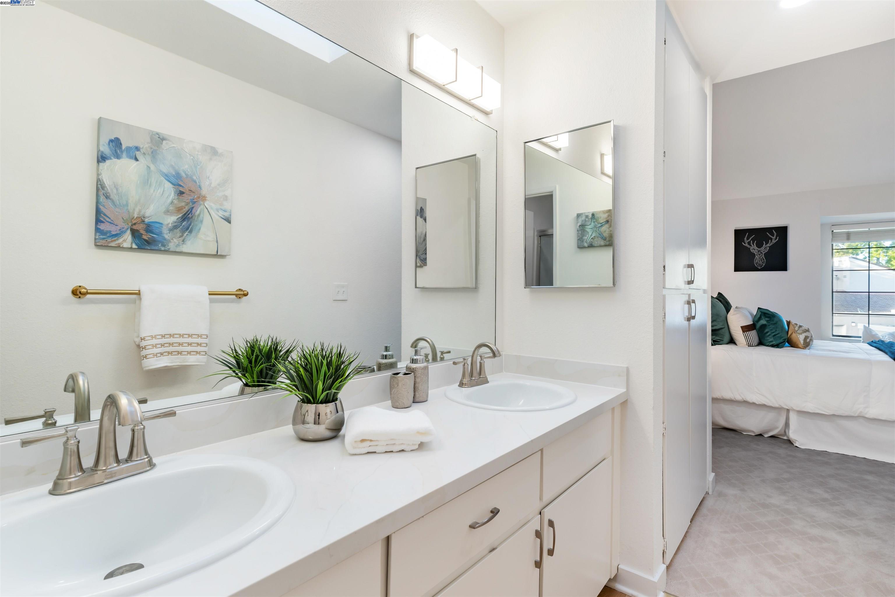 601 Palomino Drive, Unit C Pleasanton, CA 94566 - Photo 38 of 41 a bathroom with a sink double vanity and a mirror
