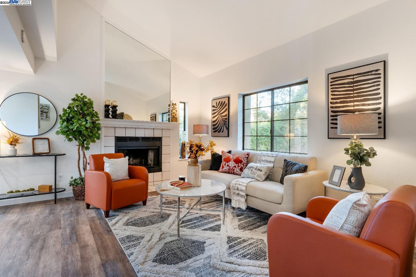 601 Palomino Drive, Unit C Pleasanton, CA 94566 - Photo 4 of 41 a living room with furniture fireplace and a large window