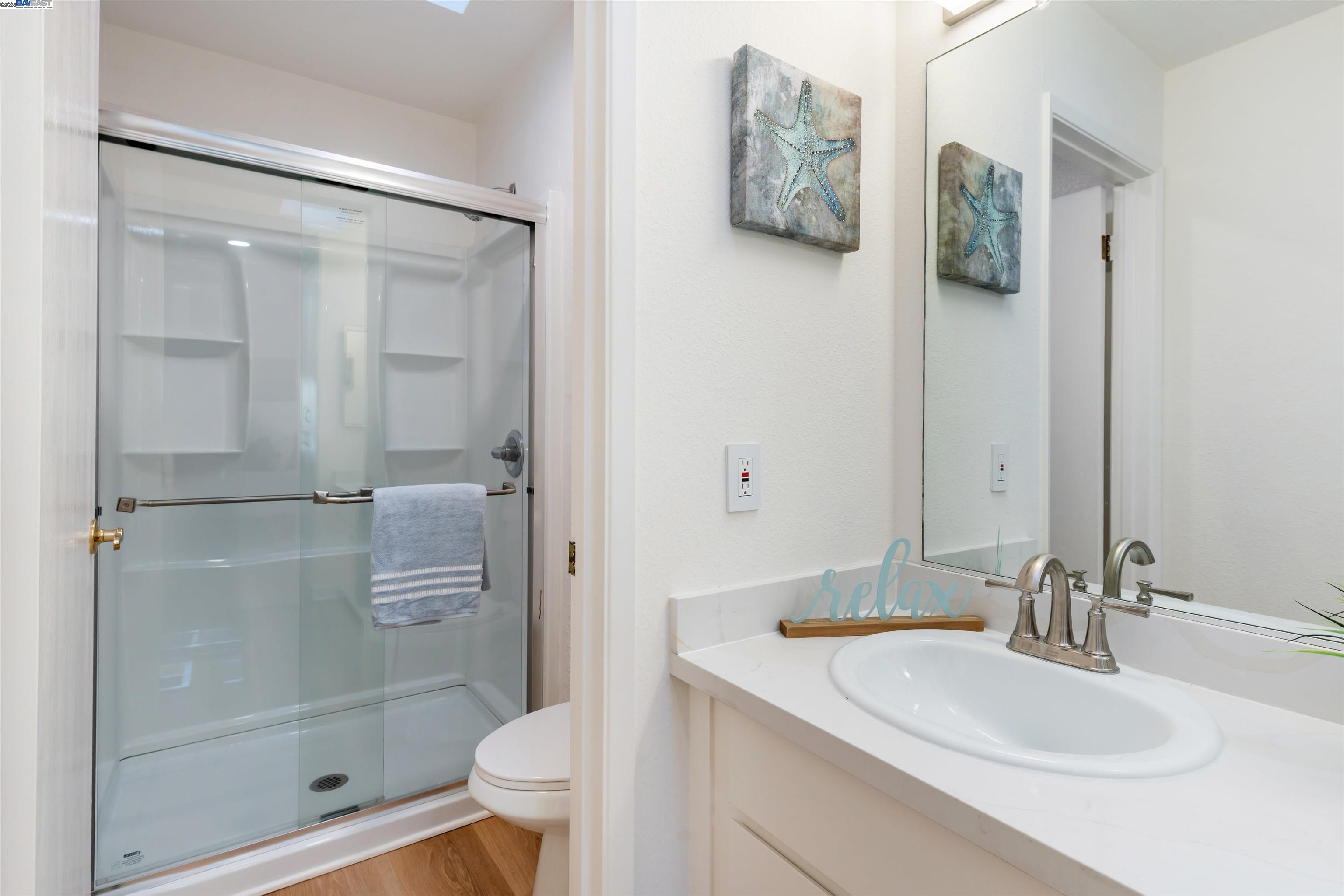 601 Palomino Drive, Unit C Pleasanton, CA 94566 - Photo 41 of 41 a bathroom with a granite countertop sink toilet and shower