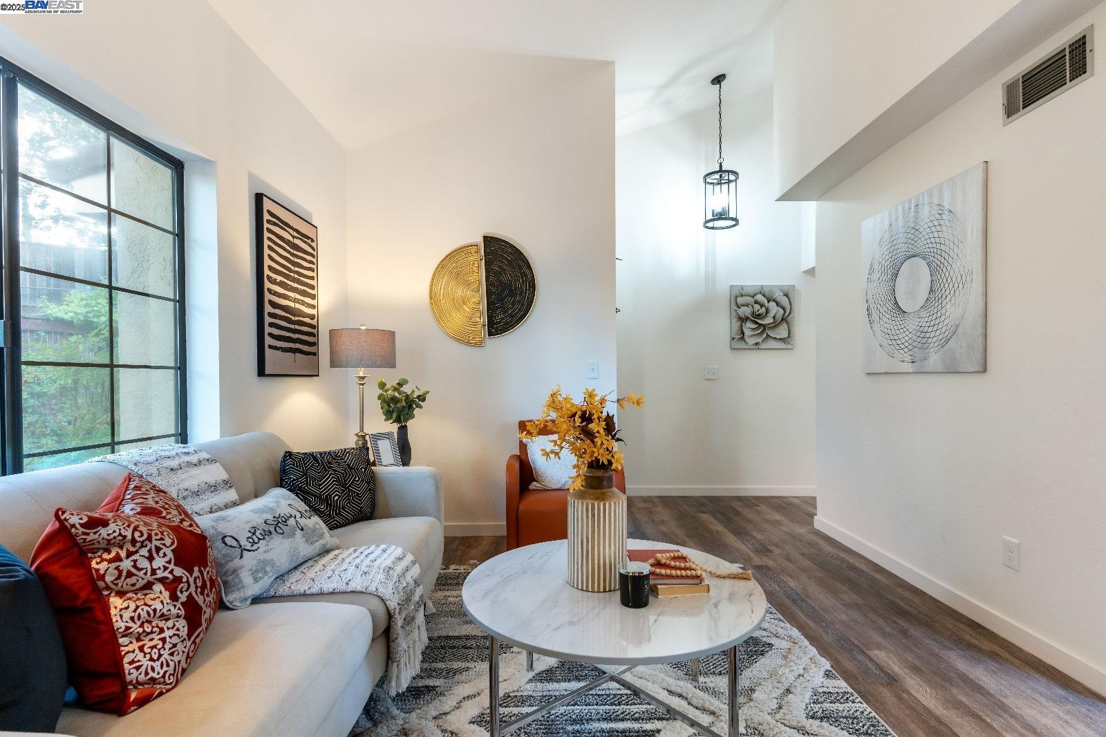 601 Palomino Drive, Unit C Pleasanton, CA 94566 - Photo 5 of 41 a living room with furniture and a mirror