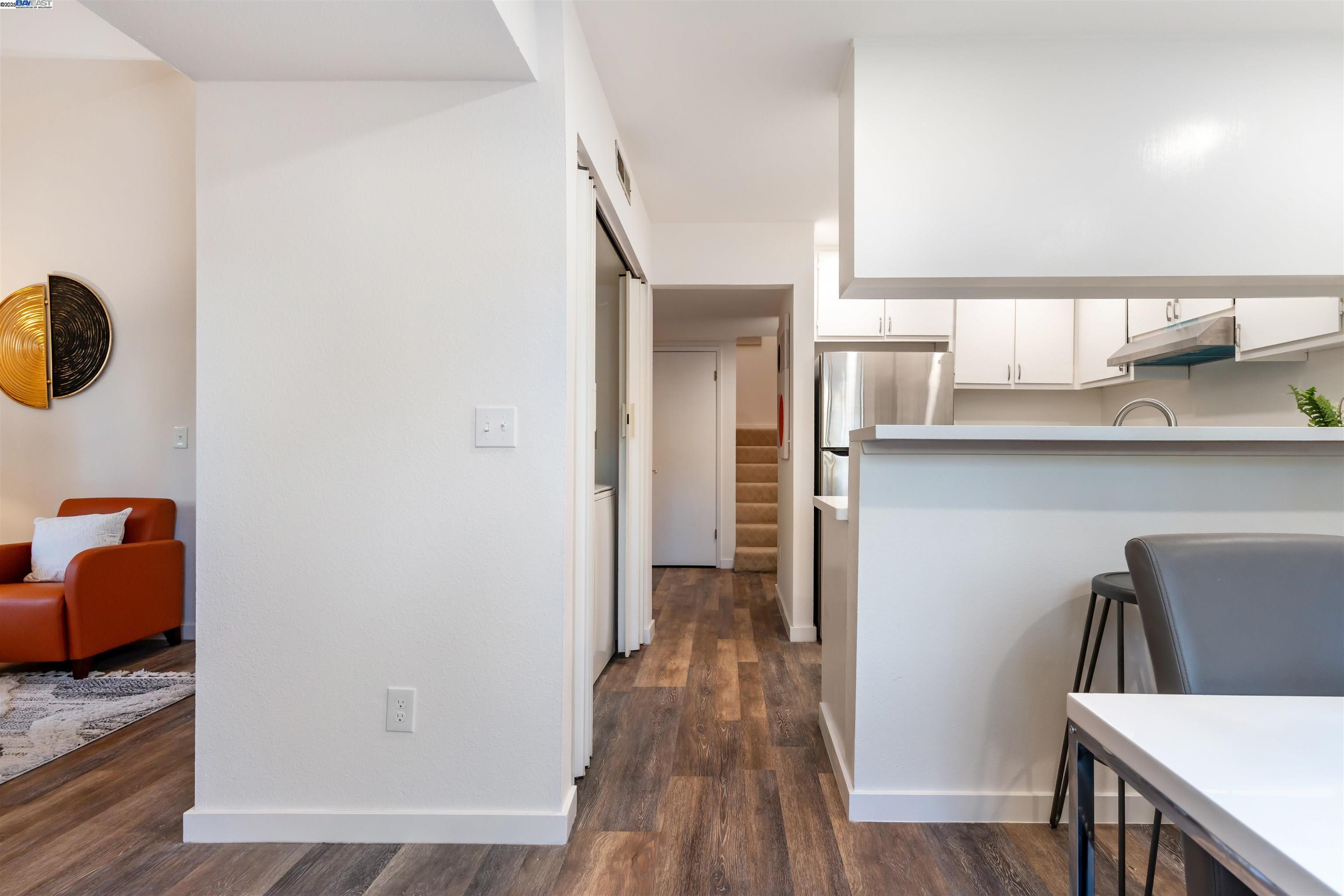 601 Palomino Drive, Unit C Pleasanton, CA 94566 - Photo 9 of 41 a view of hallway with seating and wooden floor