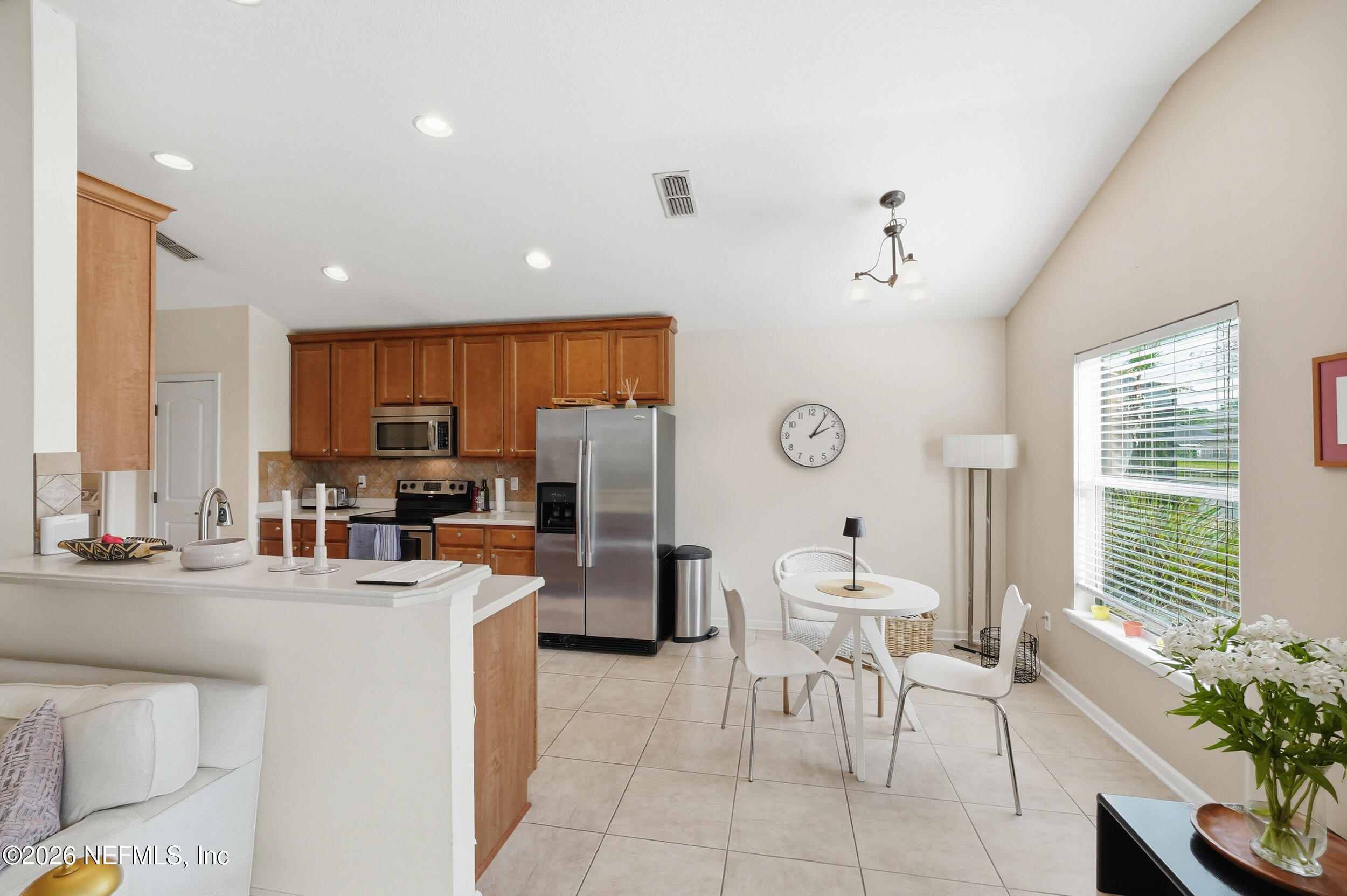 374 Porta Rosa Circle St. Augustine, FL 32092 - Photo 11 of 47 a room with stainless steel appliances lots of counter space and chair