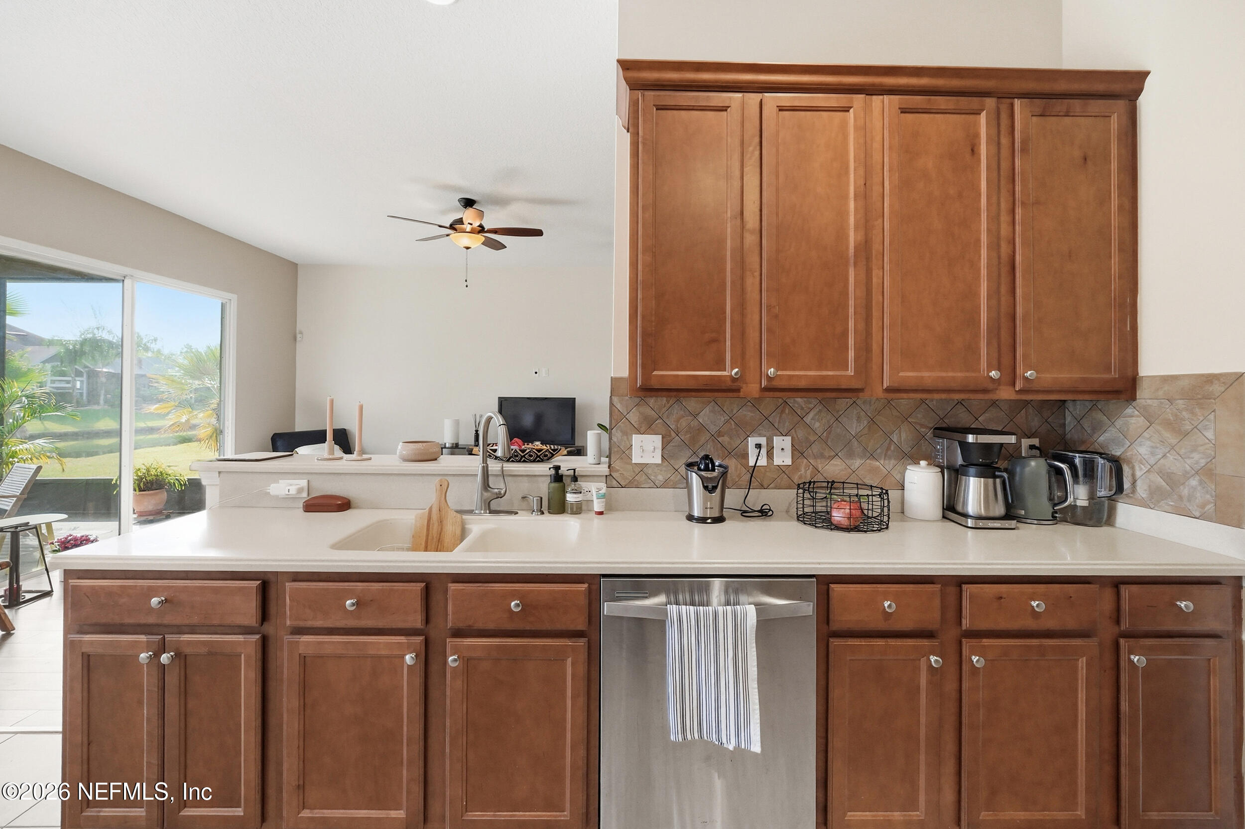 374 Porta Rosa Circle St. Augustine, FL 32092 - Photo 14 of 47 a kitchen with stainless steel appliances granite countertop a sink stove and cabinets