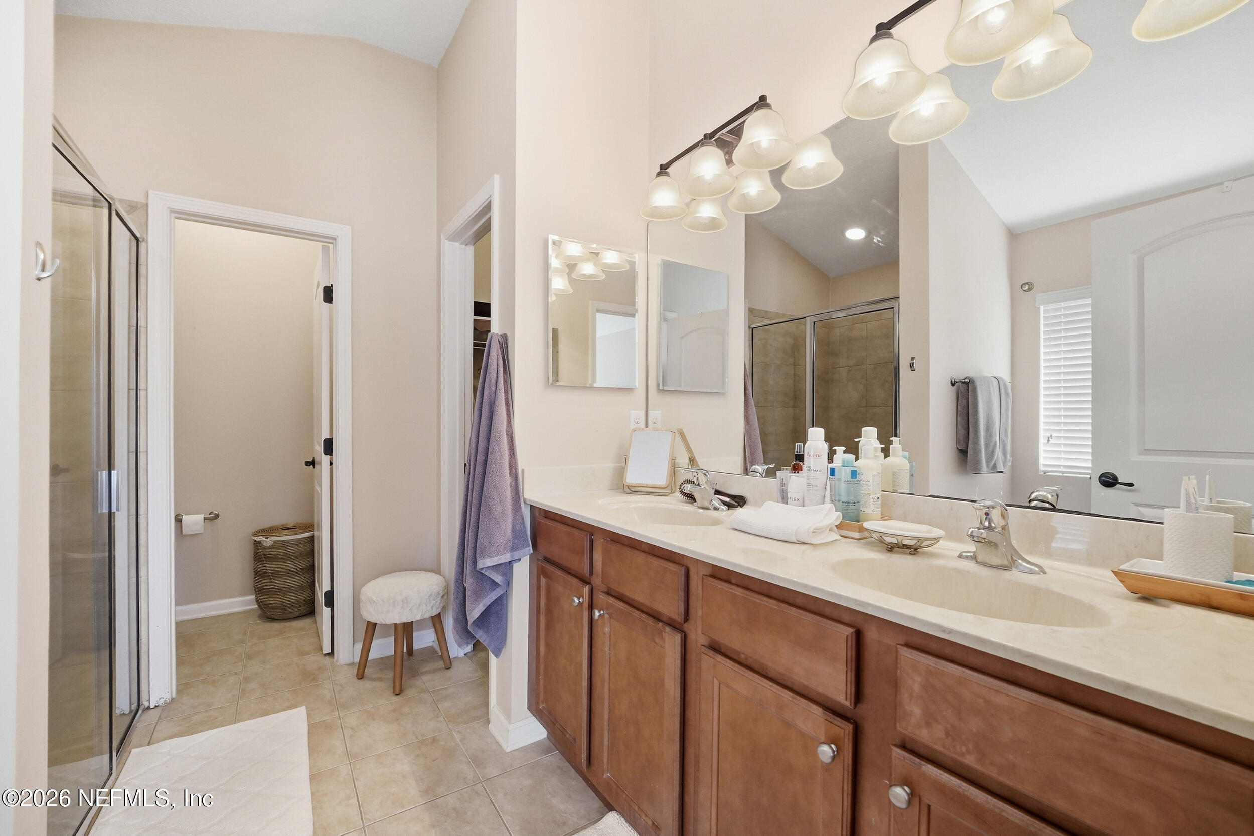 374 Porta Rosa Circle St. Augustine, FL 32092 - Photo 20 of 47 a bathroom with a sink double vanity granite and a shower