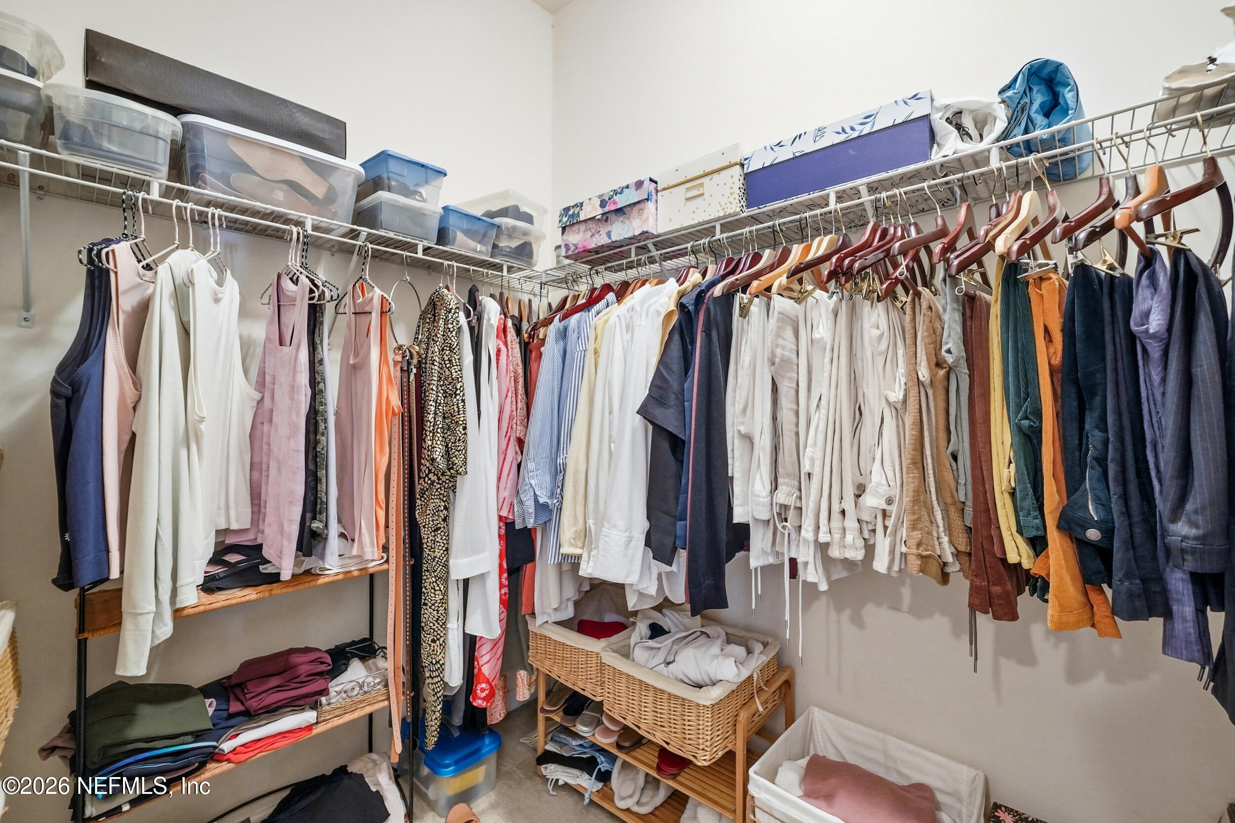 374 Porta Rosa Circle St. Augustine, FL 32092 - Photo 23 of 47 a view of walk in closet with clothes and shoes