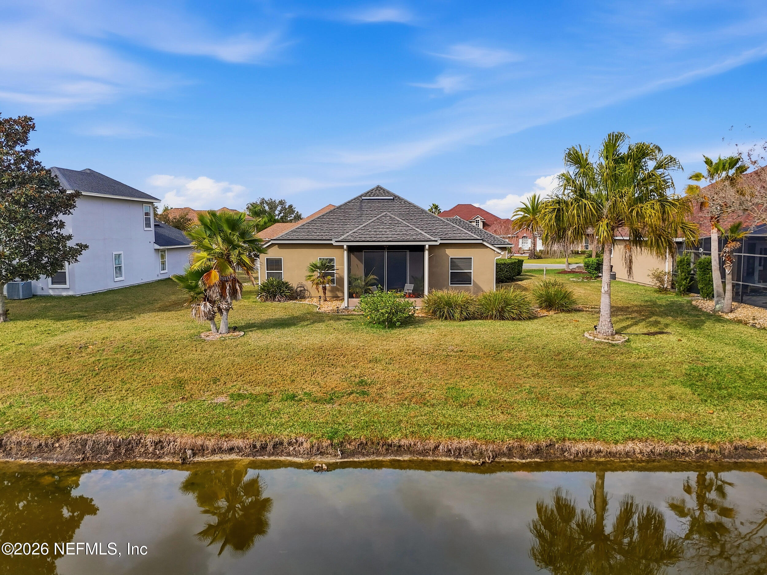 374 Porta Rosa Circle St. Augustine, FL 32092 - Photo 35 of 47 a front view of a house with a yard