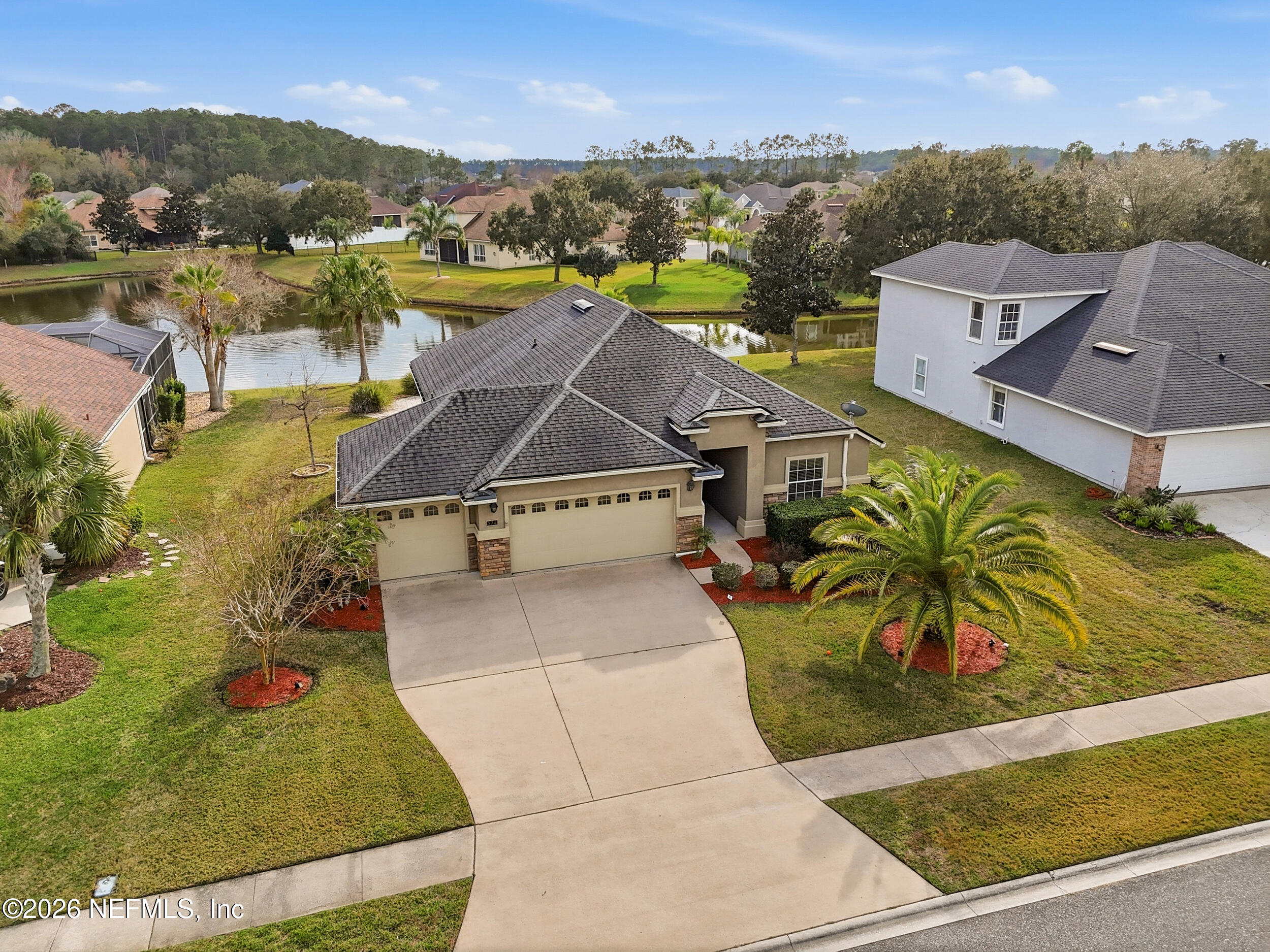 374 Porta Rosa Circle St. Augustine, FL 32092 - Photo 38 of 47 an aerial view of a house with a garden and lake view