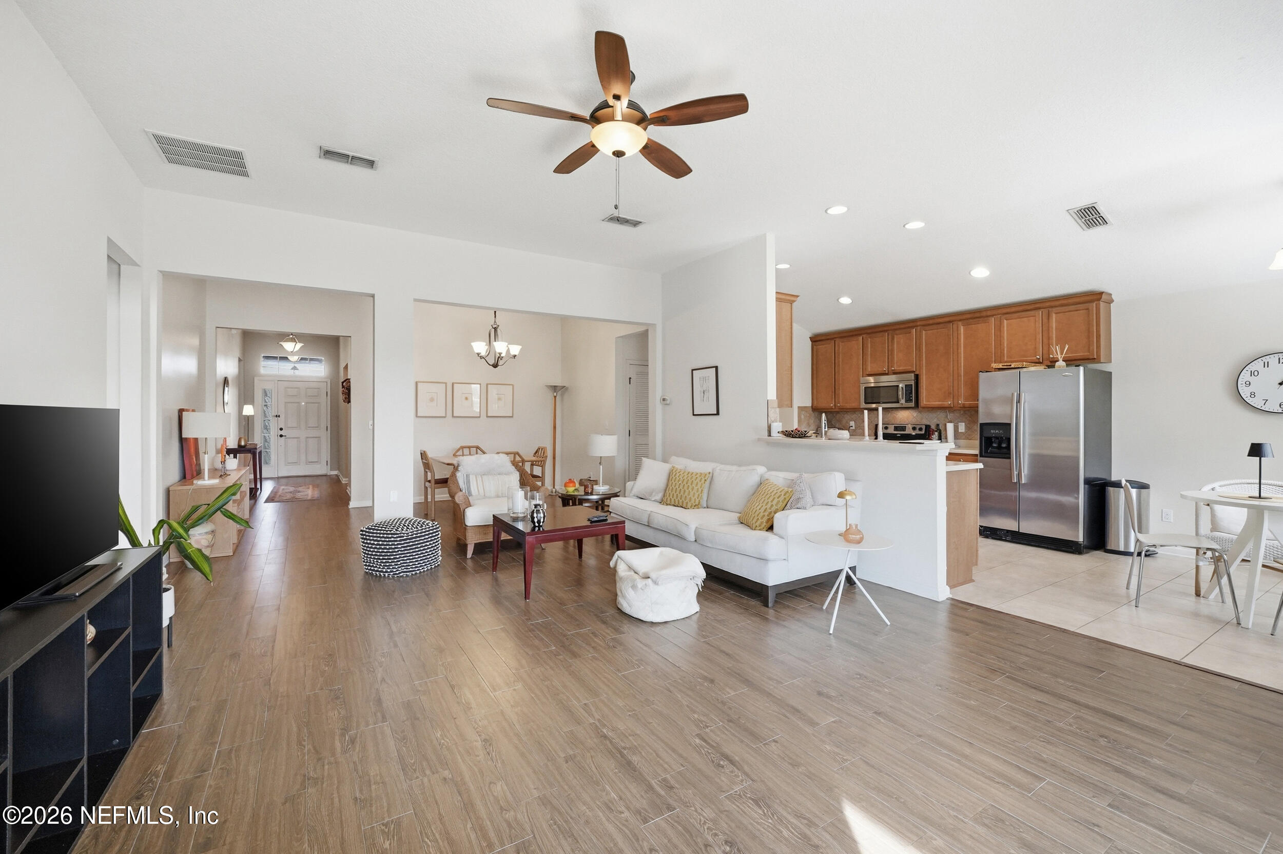 374 Porta Rosa Circle St. Augustine, FL 32092 - Photo 4 of 47 a living room with furniture kitchen view and a wooden floor