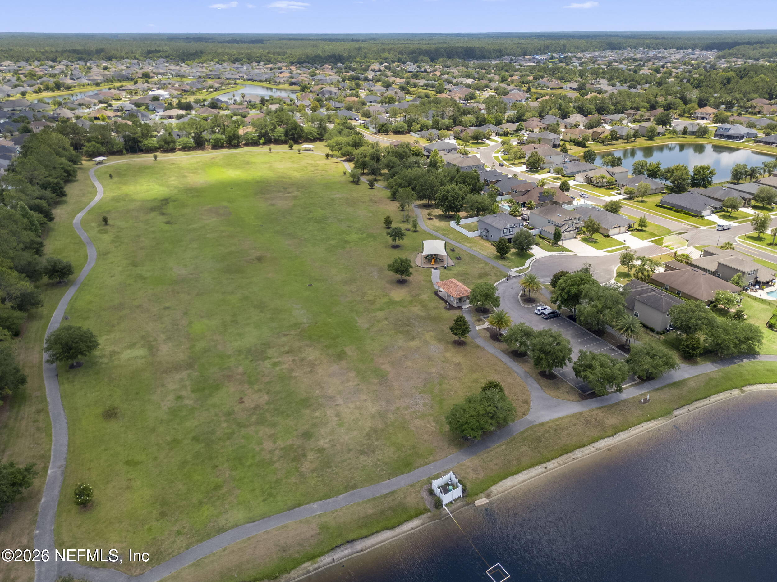 374 Porta Rosa Circle St. Augustine, FL 32092 - Photo 46 of 47 an aerial view of residential houses with outdoor space and trees