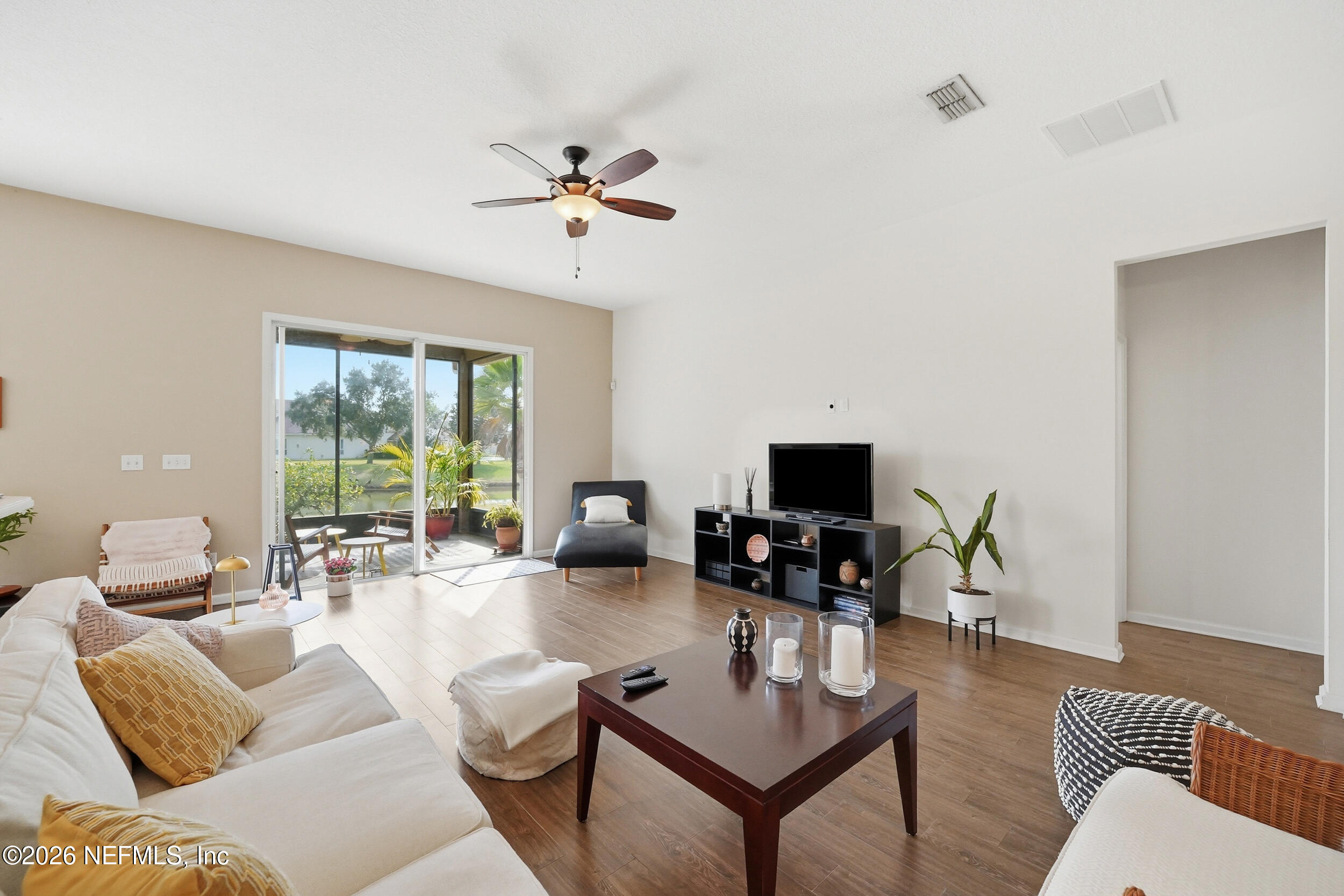 374 Porta Rosa Circle St. Augustine, FL 32092 - Photo 7 of 47 a living room with furniture and a flat screen tv