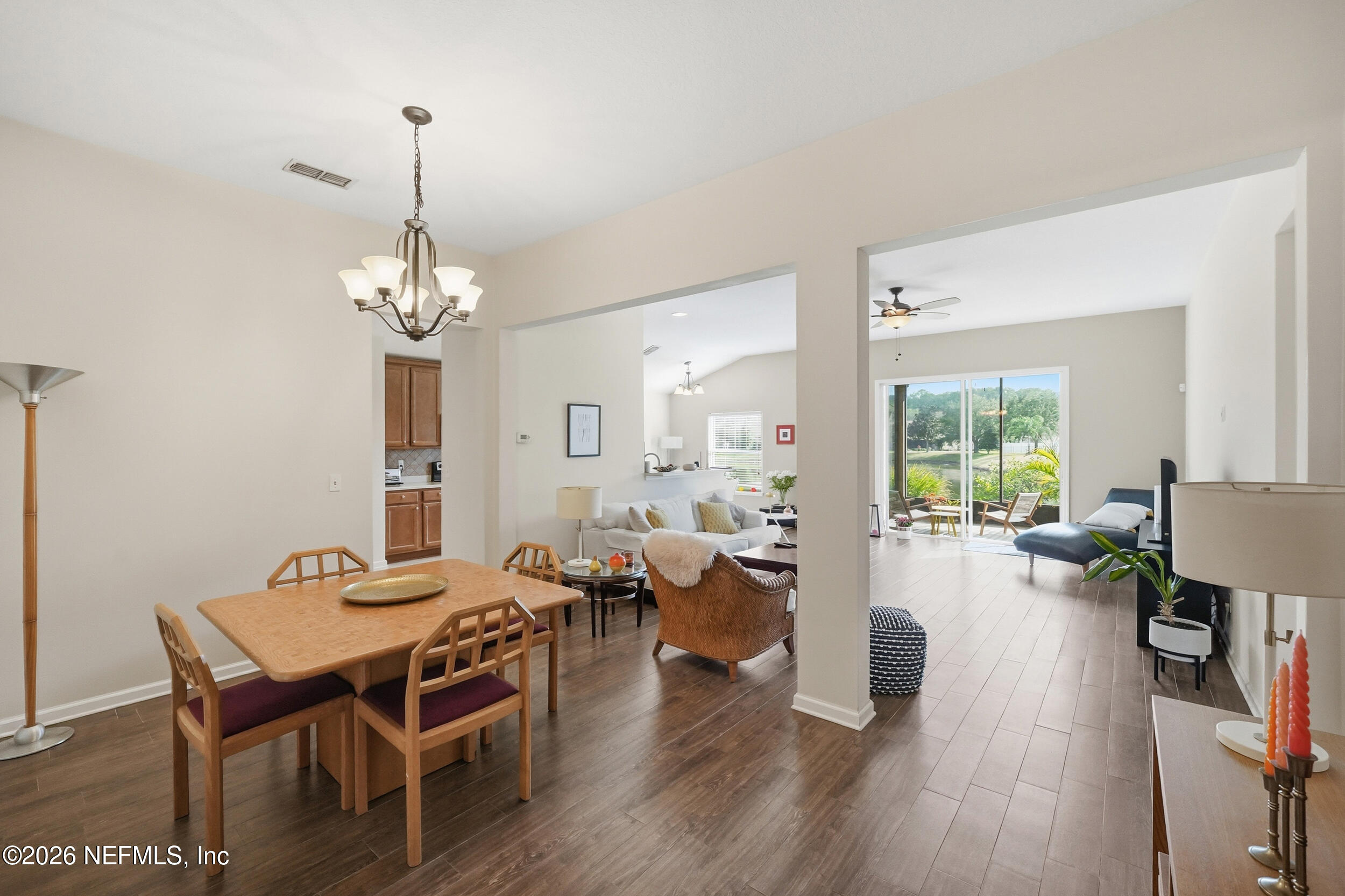 374 Porta Rosa Circle St. Augustine, FL 32092 - Photo 8 of 47 a view of a dining room with furniture wooden floor and chandelier