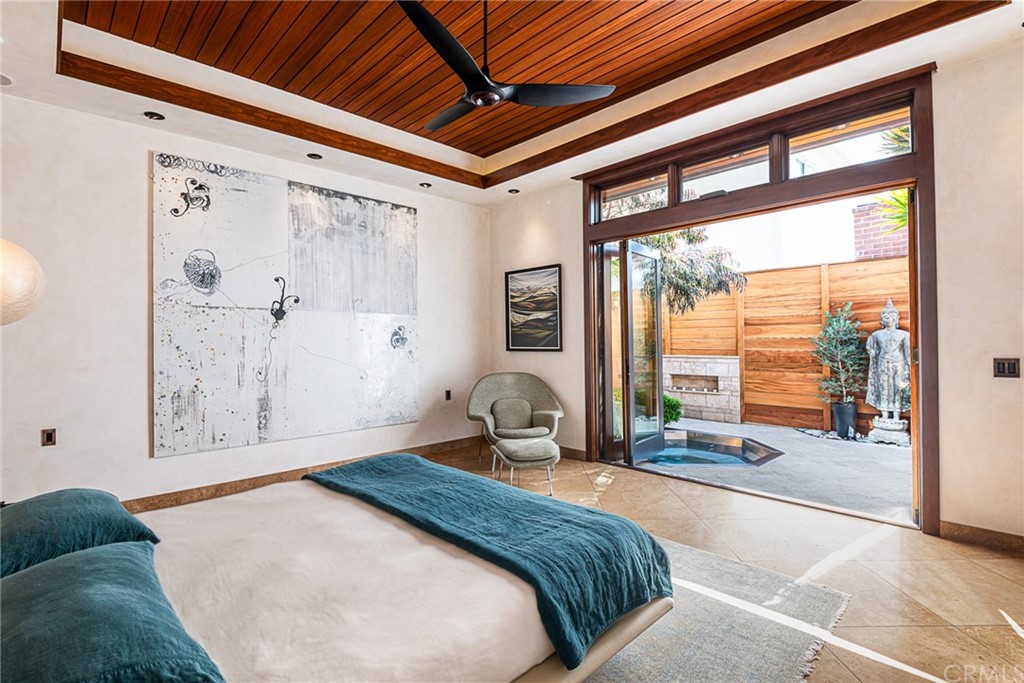 2804 The Strand Manhattan Beach, CA 90266 - Photo 16 of 51 a bedroom with a large bed and large windows