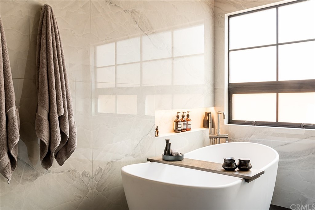 2804 The Strand Manhattan Beach, CA 90266 - Photo 21 of 51 a bathroom with a granite countertop sink and a large mirror