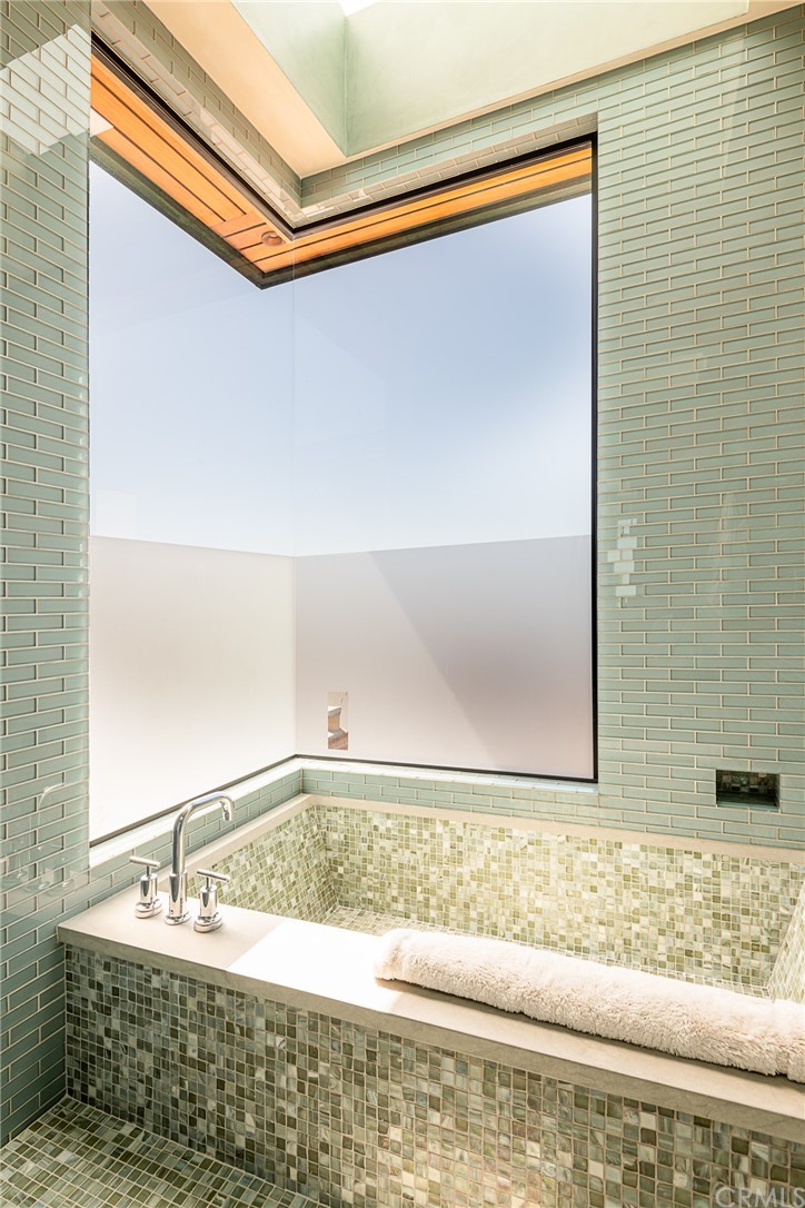 2804 The Strand Manhattan Beach, CA 90266 - Photo 43 of 51 a bathroom with a bathtub and shower