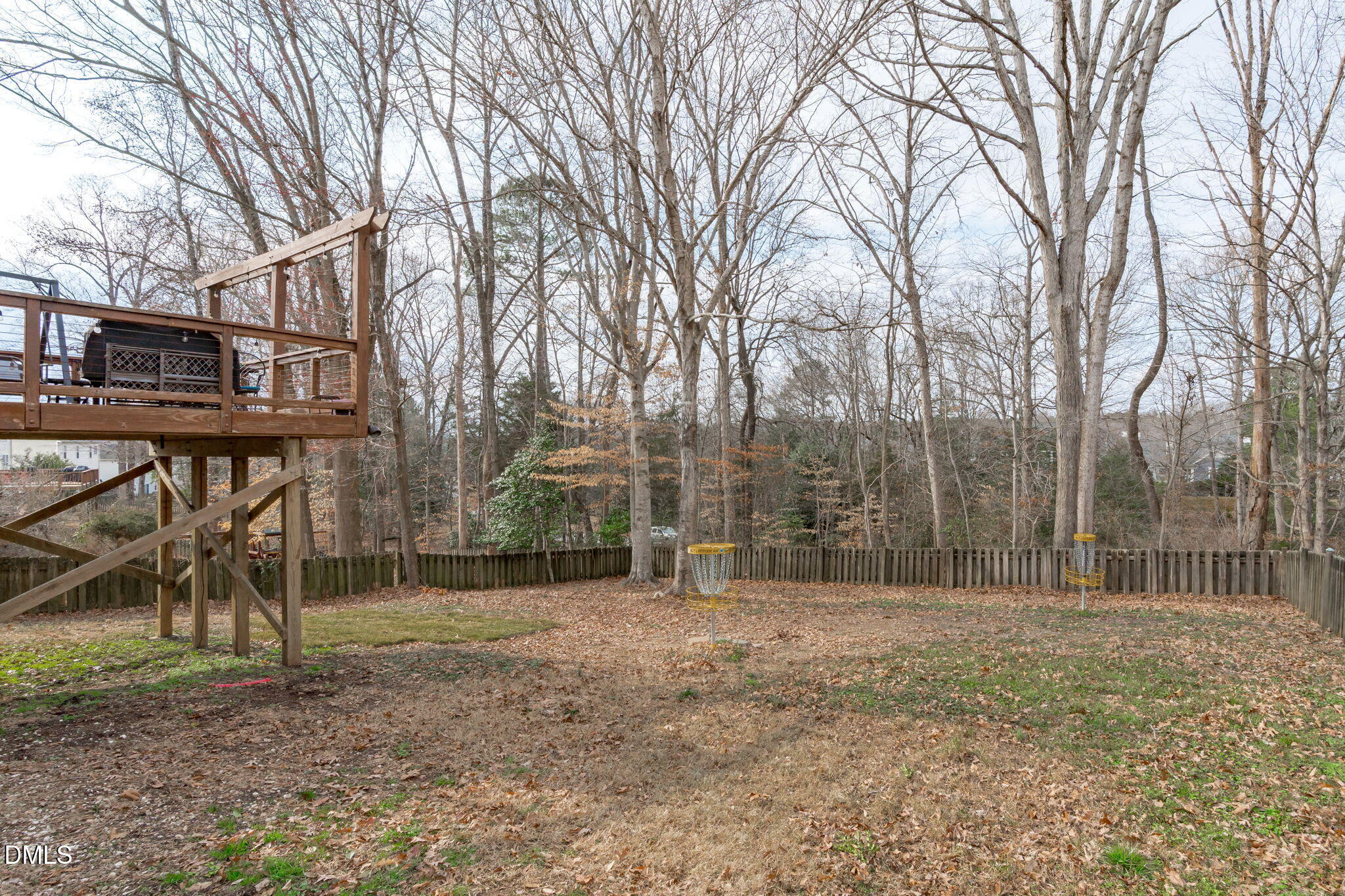 2501 Springfield Park Drive Raleigh, NC 27614 - Photo 37 of 44 a backyard of a house with lots of trees