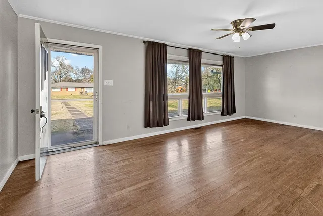 a kitchen with stainless steel appliances a stove top oven and a refrigerator