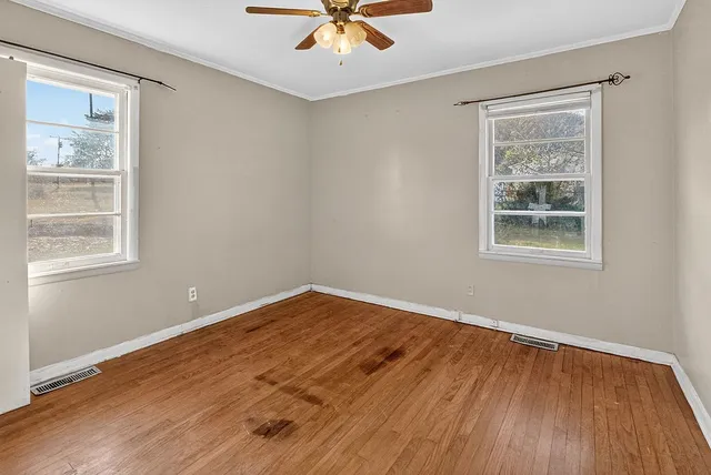 a view of an empty room with a fireplace