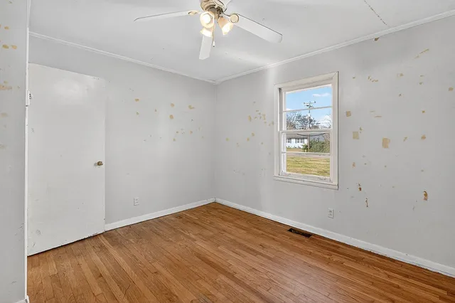 a view of a kitchen with a sink stainless steel appliances and cabinets