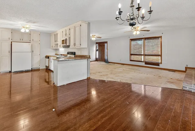 a front view of a building with a yard