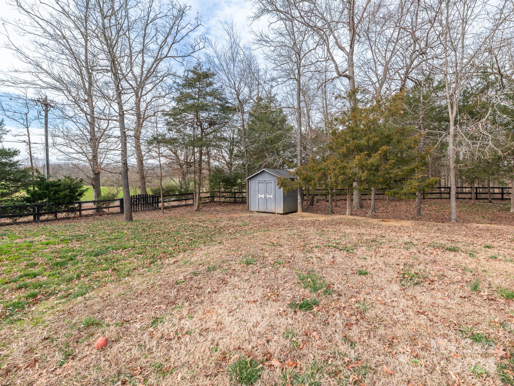 401 Funderburk Road Wingate, NC 28174 - Photo 11 of 36 a backyard of a house with lots of green space