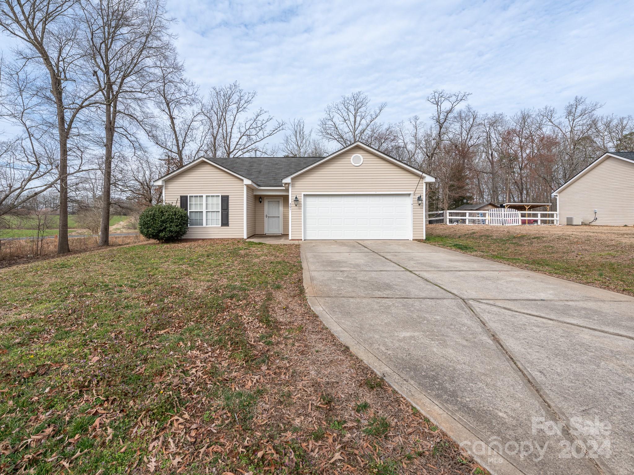 401 Funderburk Road Wingate, NC 28174 - Photo 12 of 36 a view of a house with a yard covered in snow