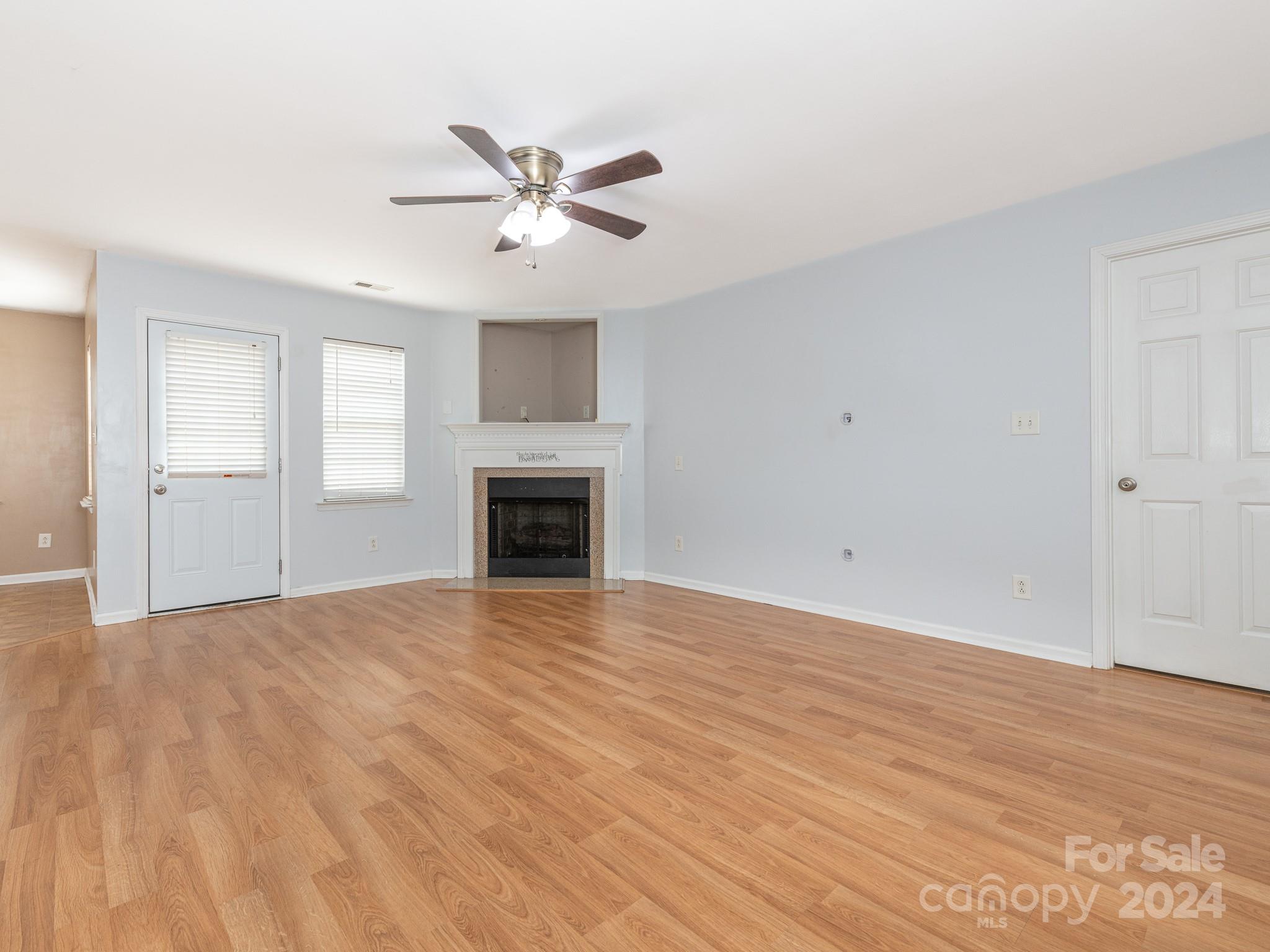 401 Funderburk Road Wingate, NC 28174 - Photo 13 of 36 a view of empty room with wooden floor and fan
