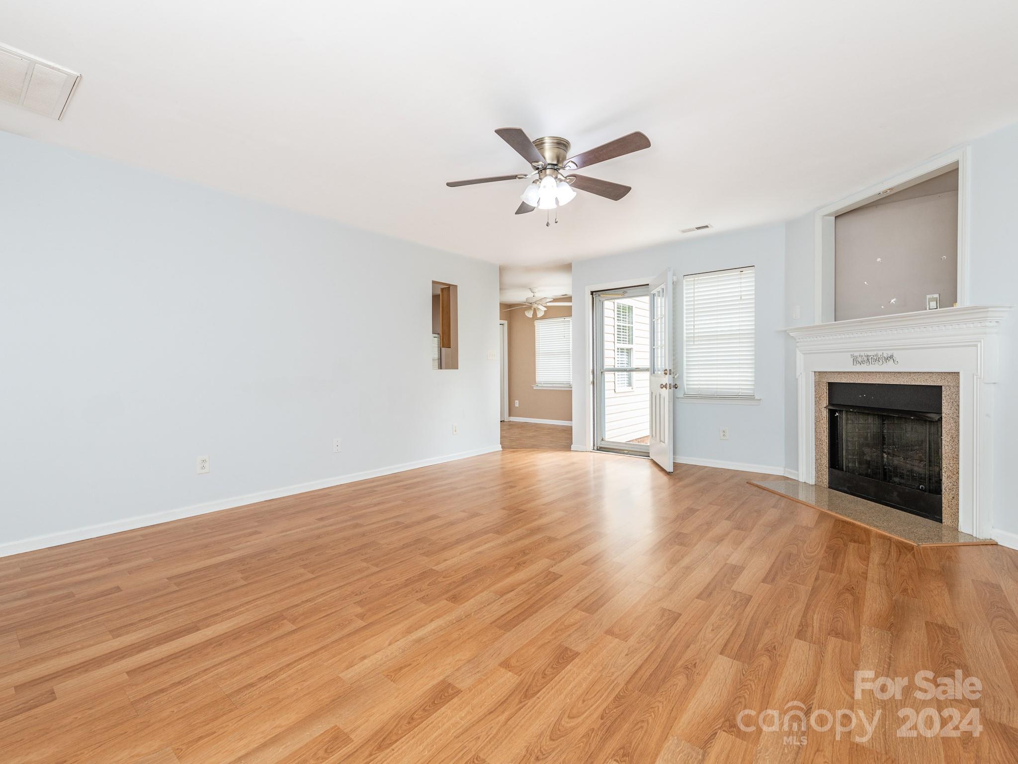 401 Funderburk Road Wingate, NC 28174 - Photo 16 of 36 a view of an empty room with a window and fireplace