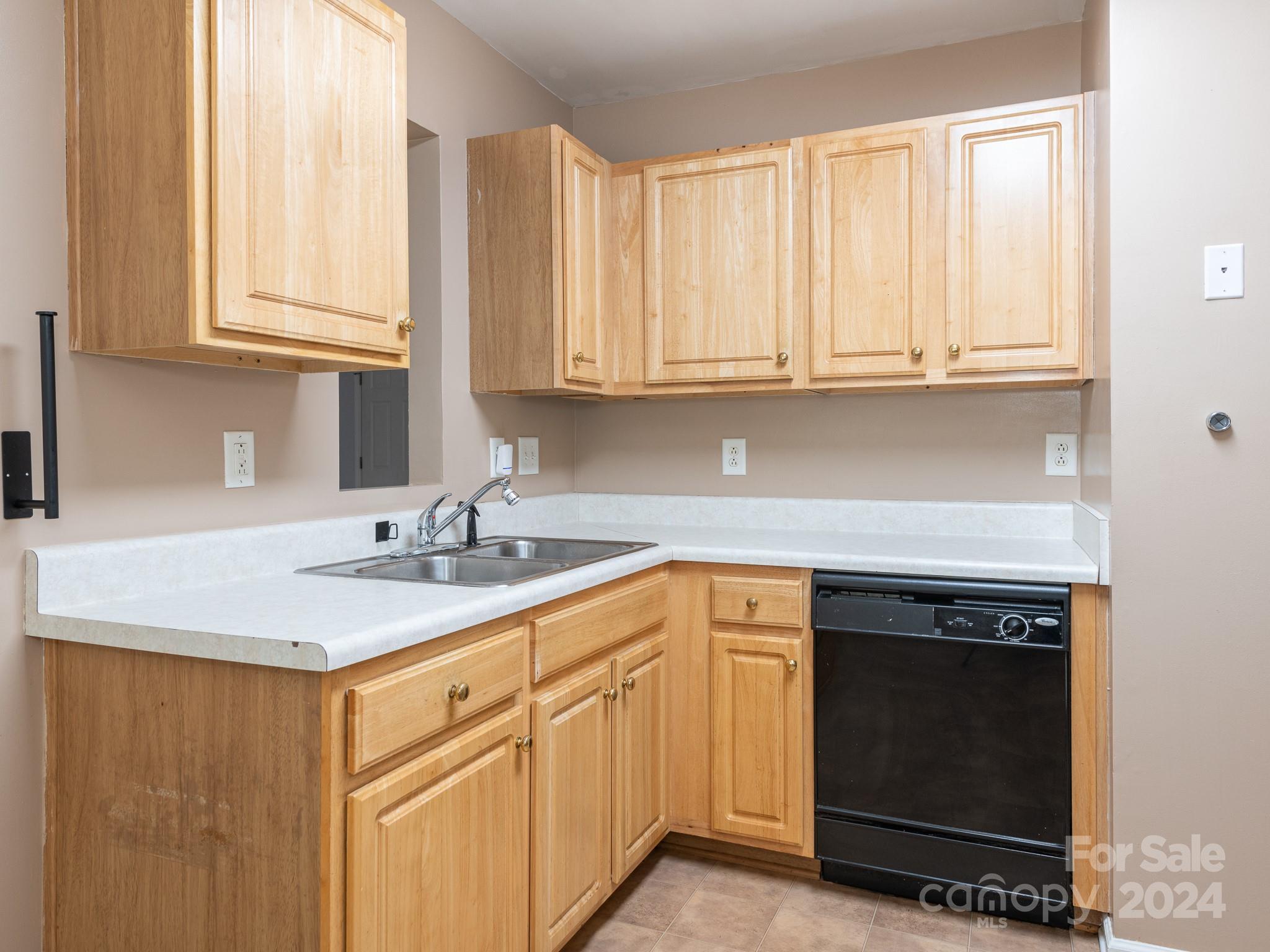 401 Funderburk Road Wingate, NC 28174 - Photo 19 of 36 a kitchen with granite countertop white cabinets and a sink