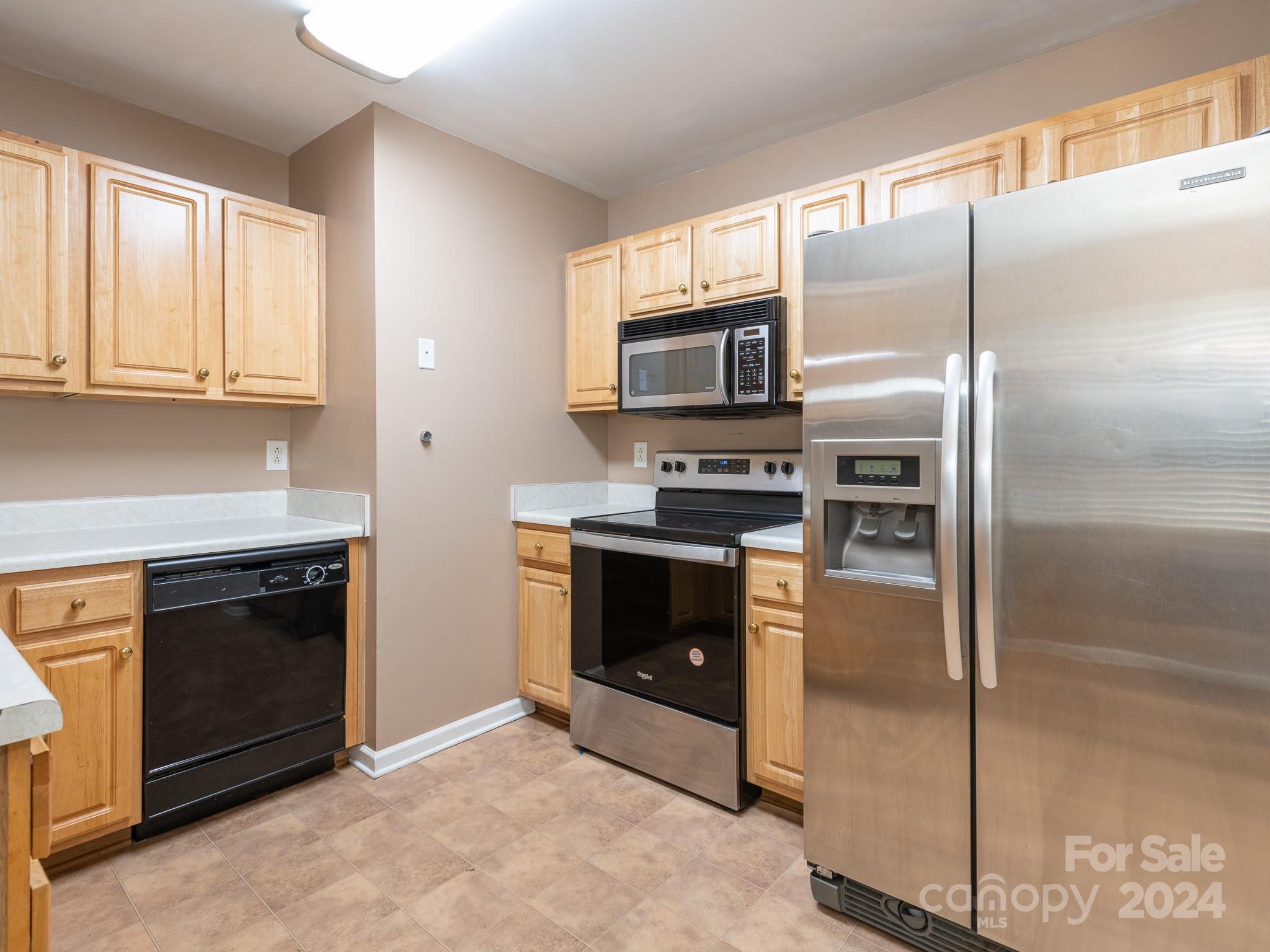 401 Funderburk Road Wingate, NC 28174 - Photo 20 of 36 a kitchen with granite countertop a refrigerator and a stove