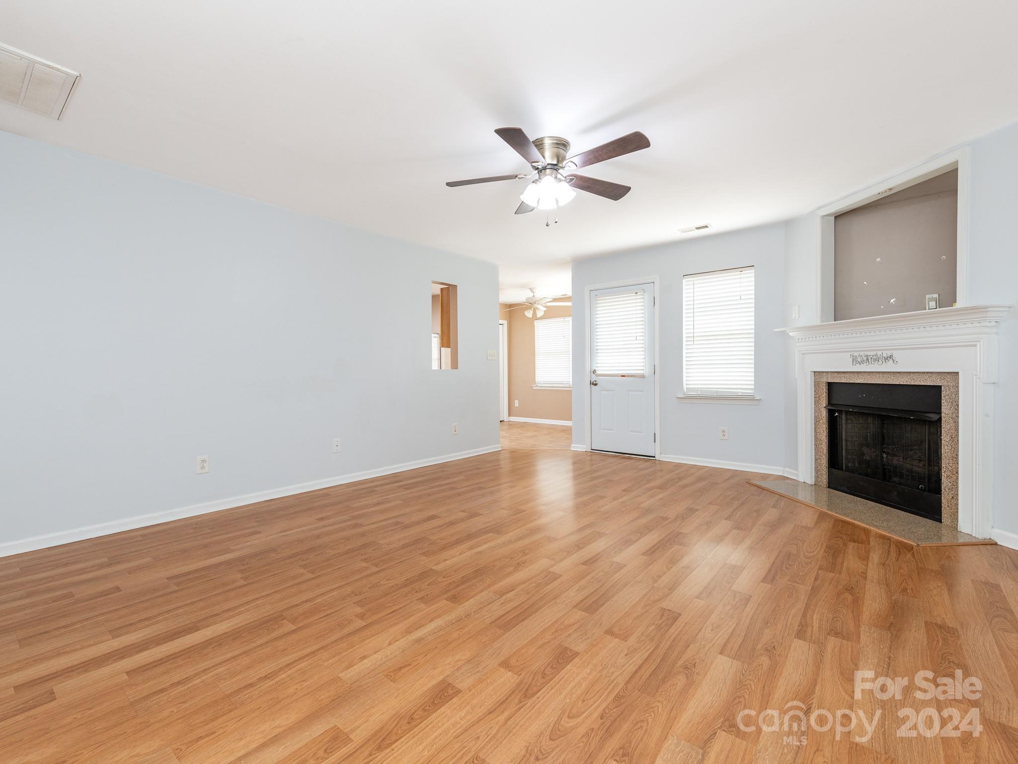 401 Funderburk Road Wingate, NC 28174 - Photo 2 of 36 a view of empty room with wooden floor and fan