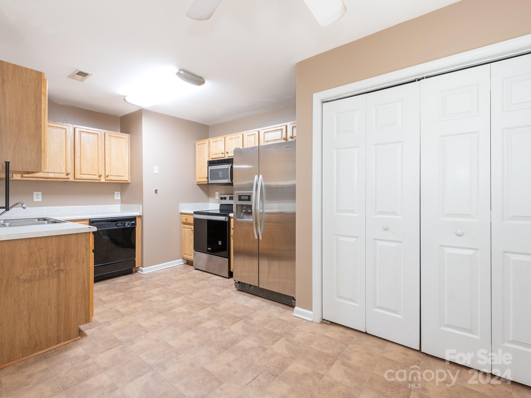 401 Funderburk Road Wingate, NC 28174 - Photo 21 of 36 a kitchen with stainless steel appliances granite countertop a refrigerator and a sink