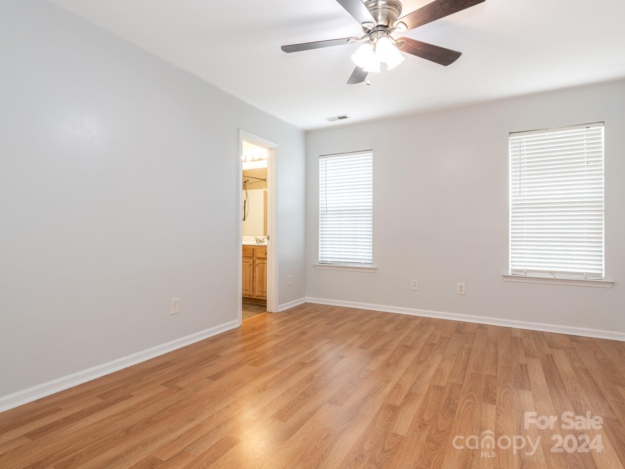 401 Funderburk Road Wingate, NC 28174 - Photo 23 of 36 wooden floor in an empty room with a window