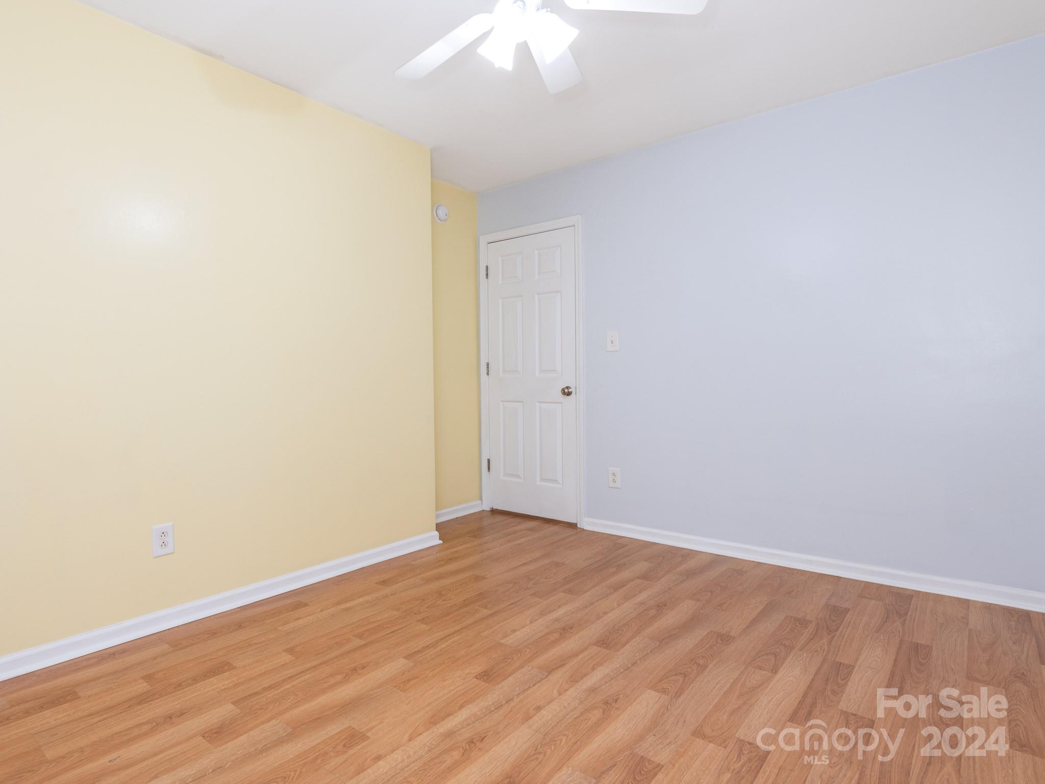 401 Funderburk Road Wingate, NC 28174 - Photo 26 of 36 an empty room with wooden floor and fan