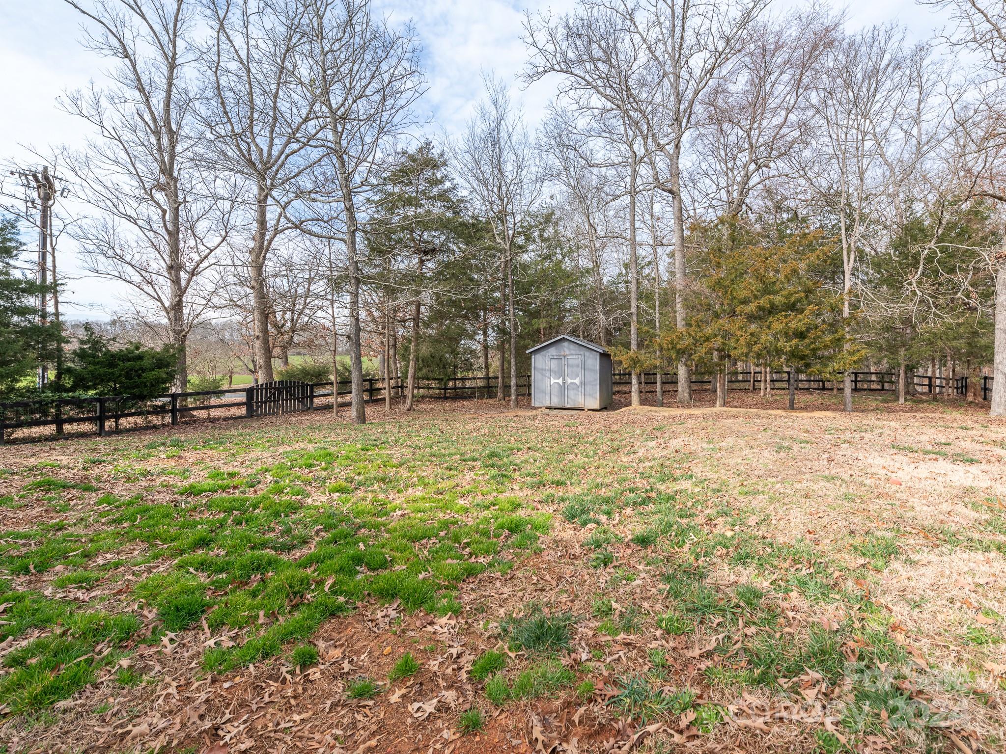 401 Funderburk Road Wingate, NC 28174 - Photo 28 of 36 a backyard of a house with lots of green space
