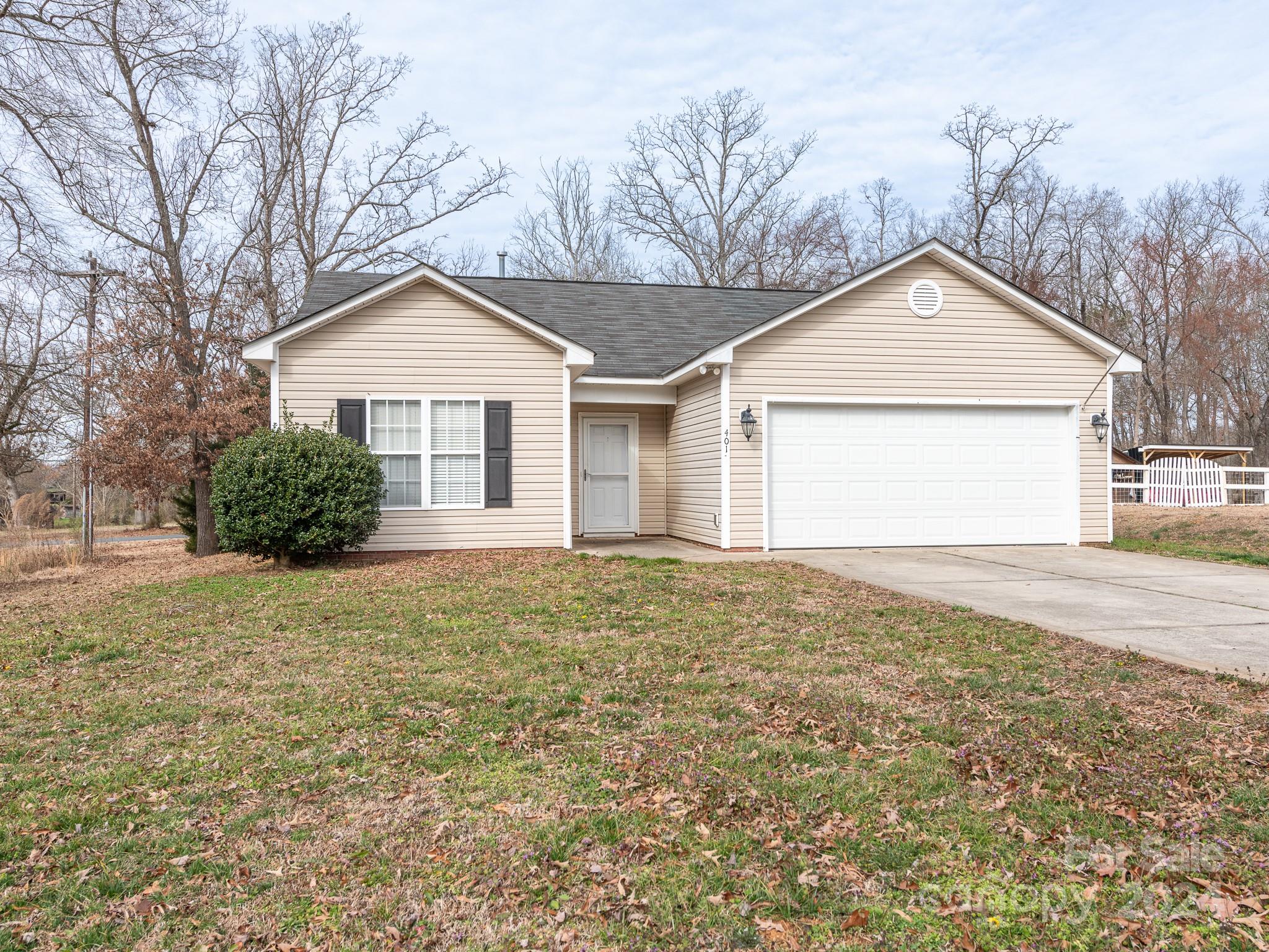 401 Funderburk Road Wingate, NC 28174 - Photo 30 of 36 a view of a house with a yard and garage