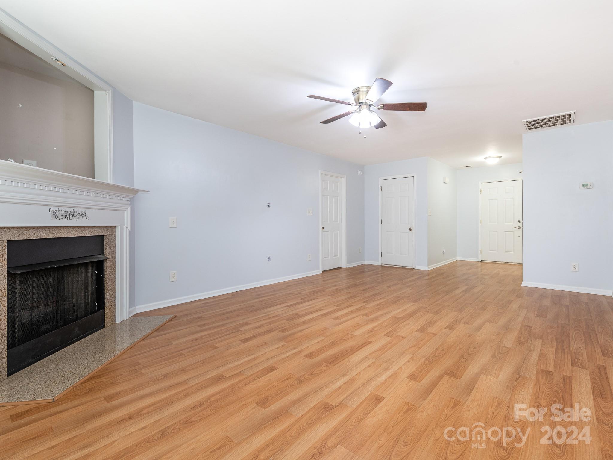 401 Funderburk Road Wingate, NC 28174 - Photo 31 of 36 a view of empty room with fan and fireplace
